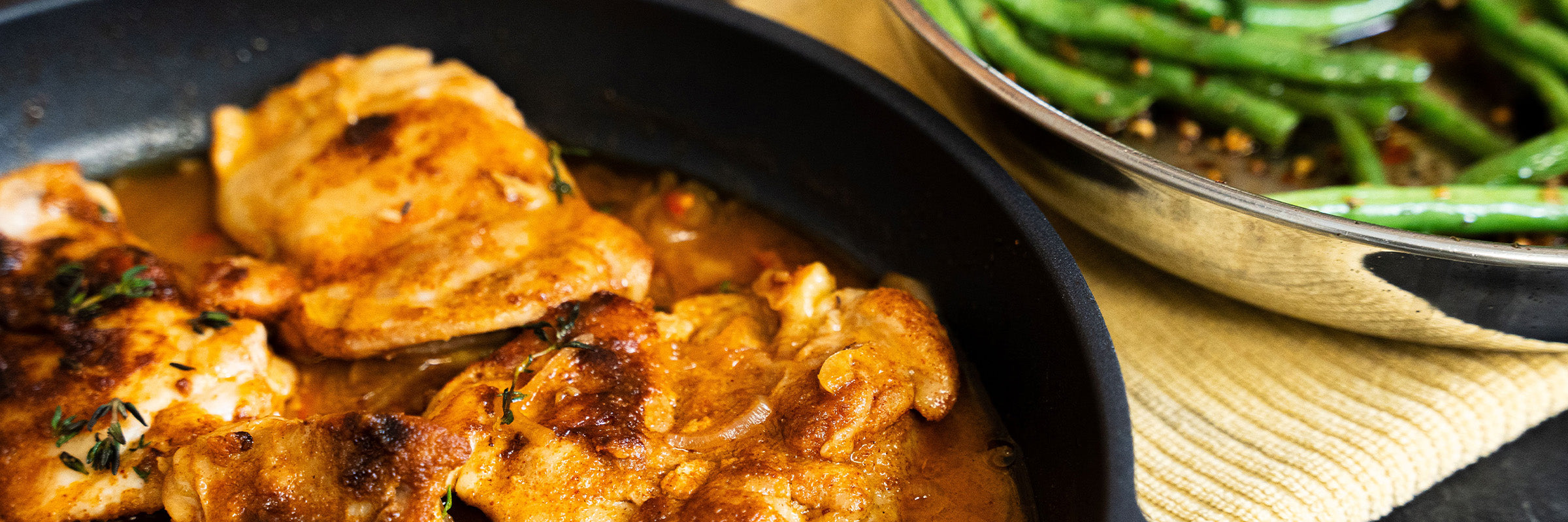 closeout sale cookware including fry pans, saute pans, stock pots on kitchen stove top