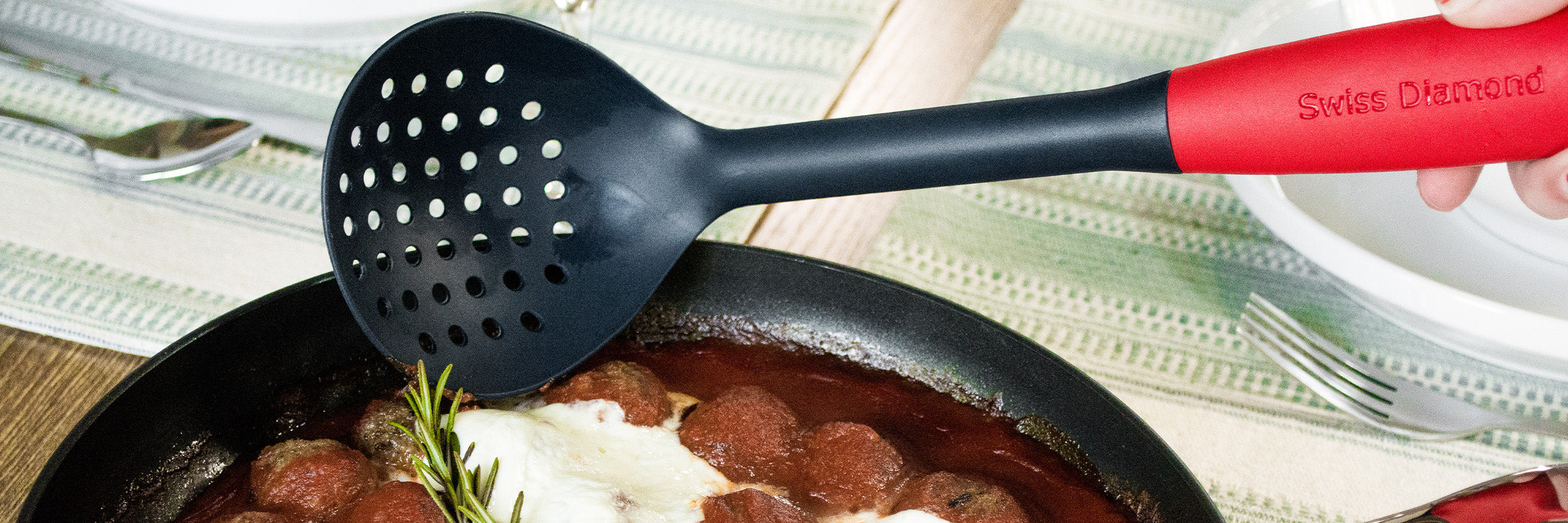ladle kitchen tool scooping out food from inside a sauce pot