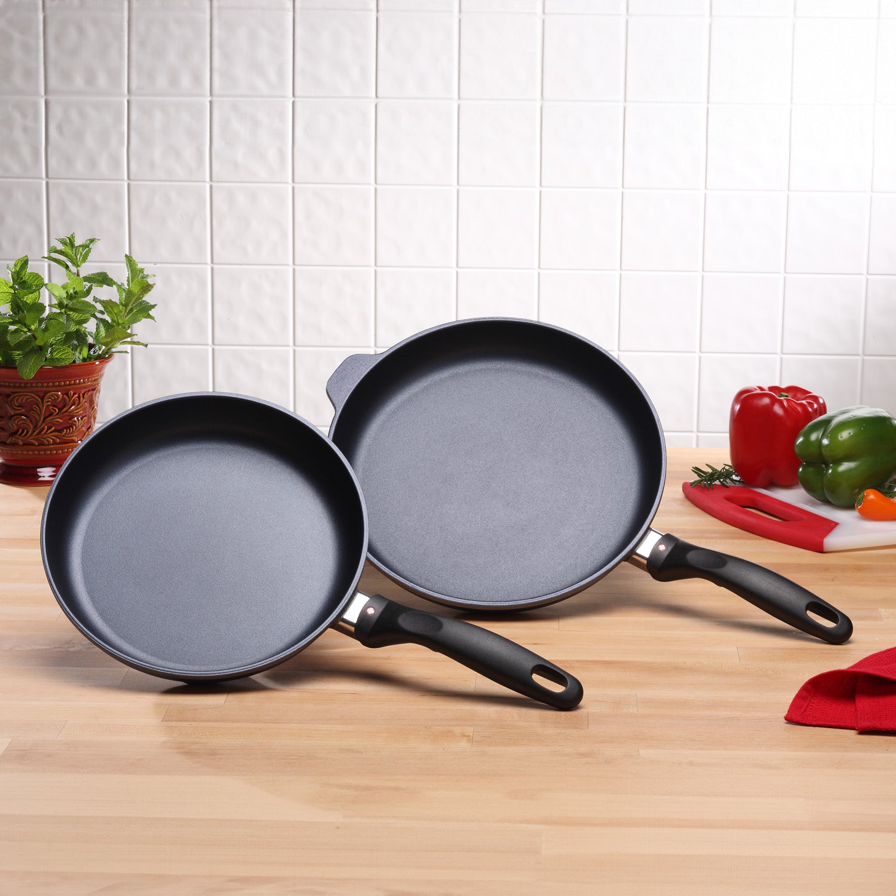 HD Nonstick 9.5" & 11" 2-Piece Set at an angle standing on kitchen counter