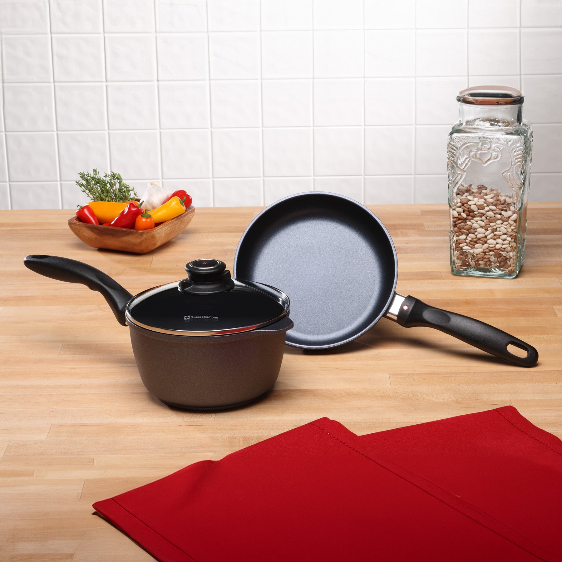 HD Nonstick 3-Piece Set - Fry Pan & Saucepan in use at an angle standing on kitchen counter