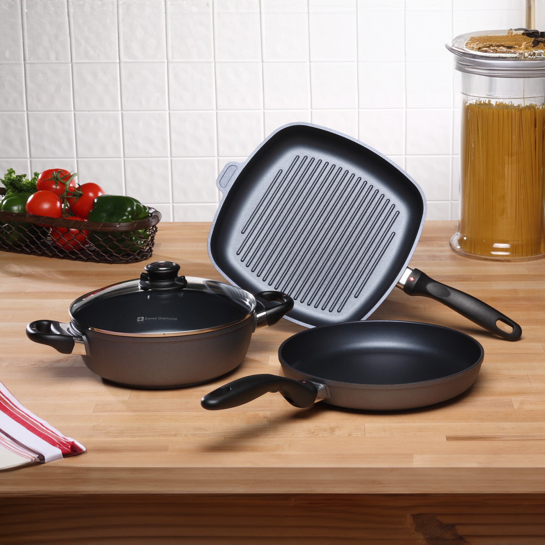 HD Nonstick 4-Piece Set - Fry Pan, Casserole & Grill Pan in use on kitchen counter