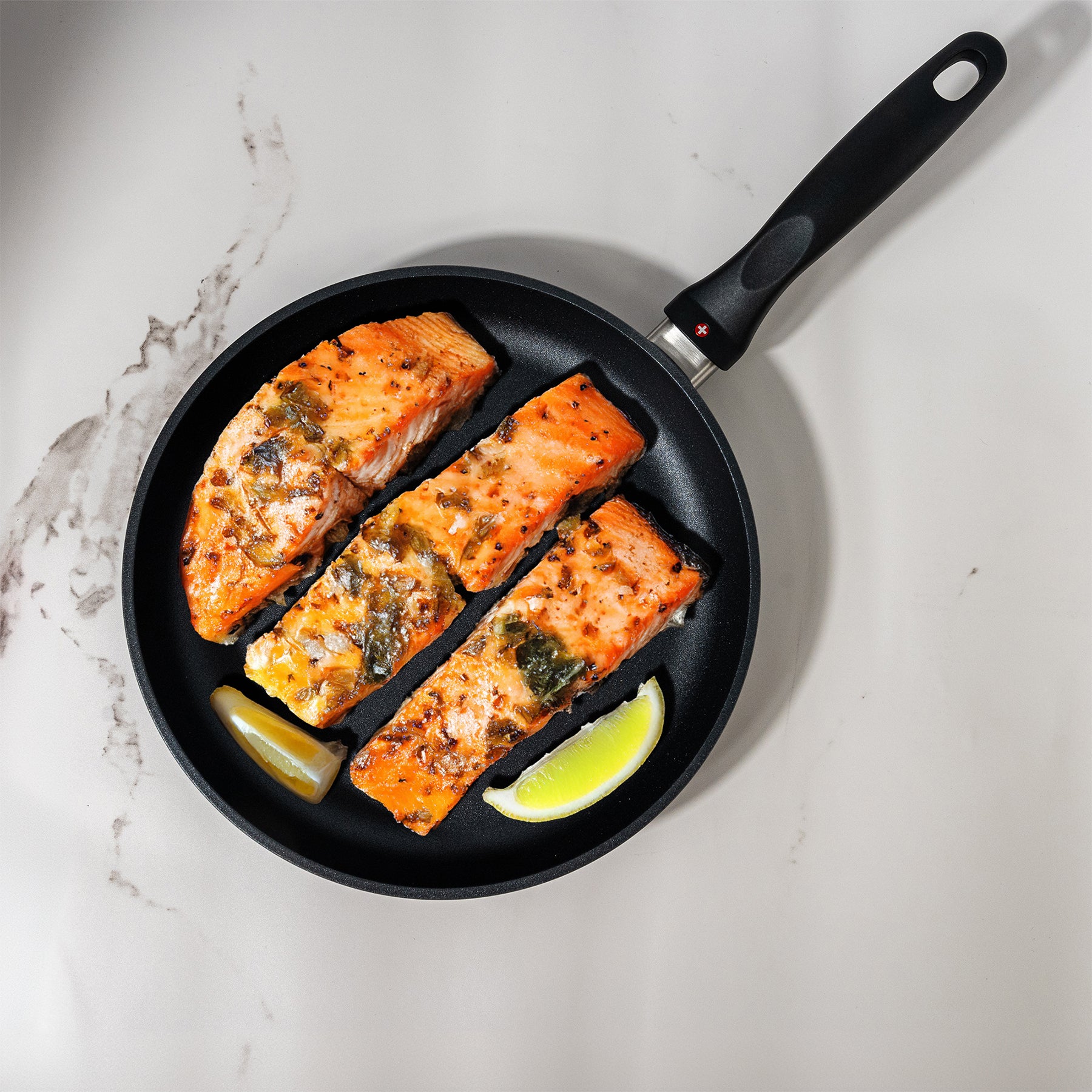 HD Nonstick Fry Pan in use on marble kitchen counter with food inside pan