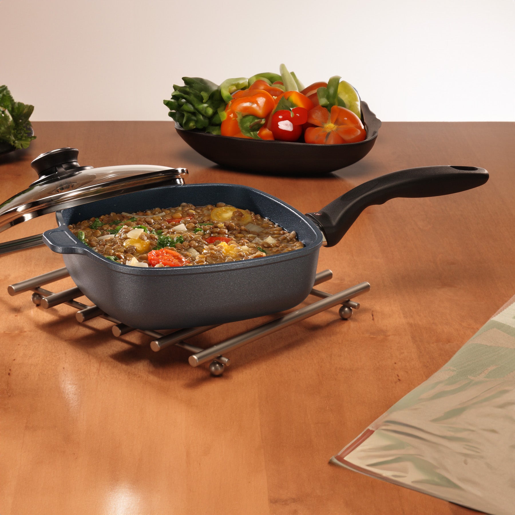 HD Nonstick Square Saute Pan with Glass Lid in use on dining room table