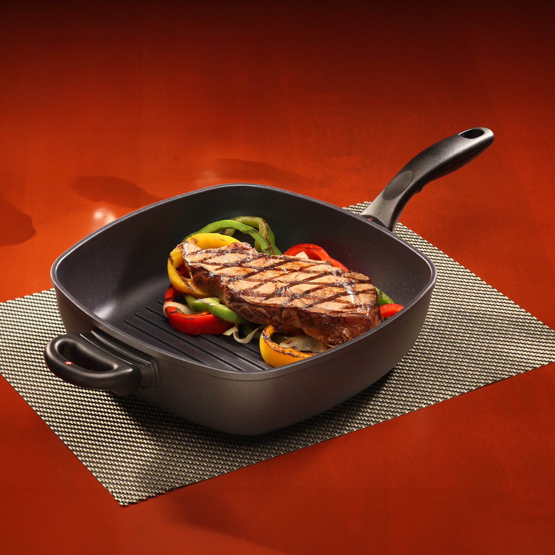 HD Nonstick 11" x 11" Deep Square Grill Pan in use on dining room table