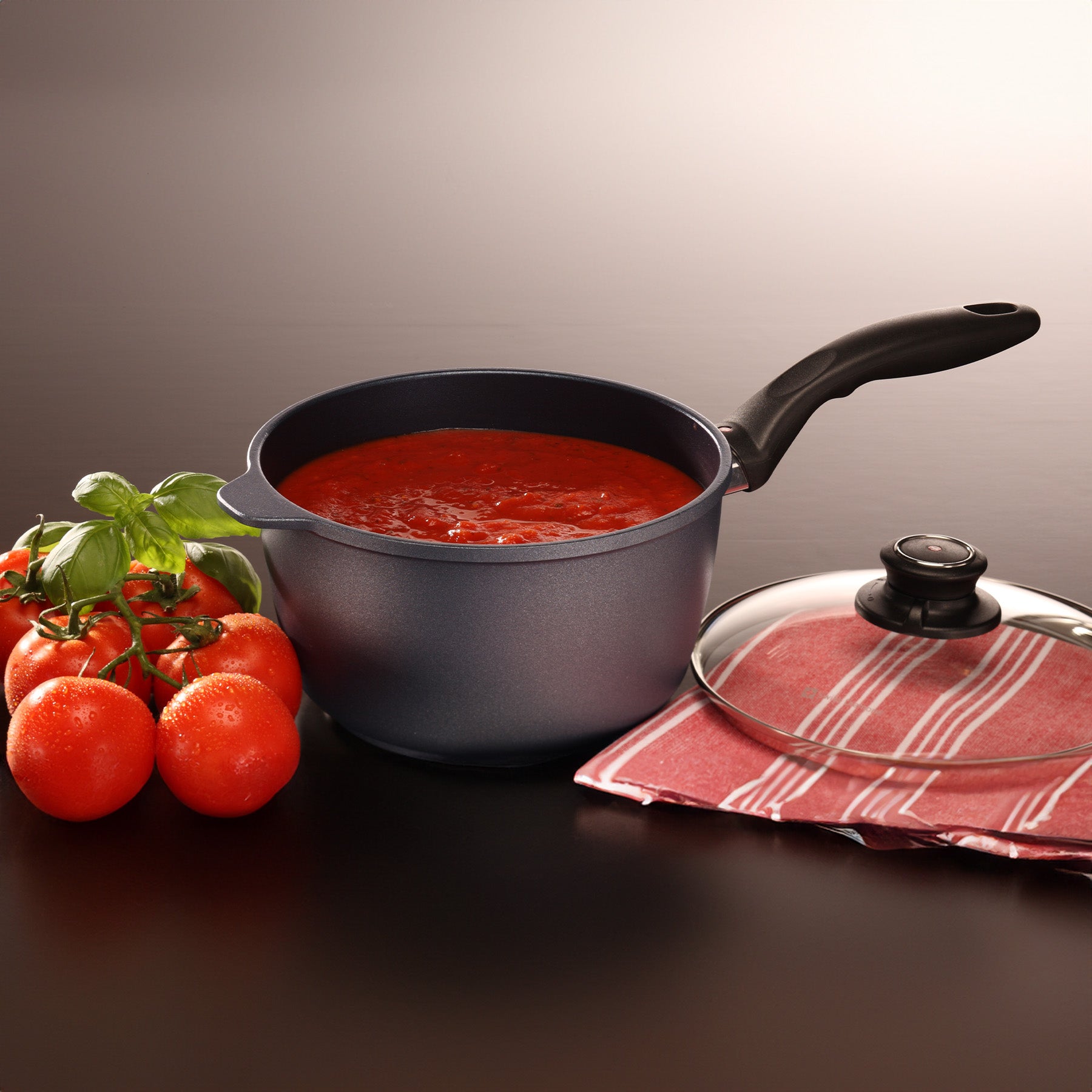 HD Nonstick Saucepan with Glass Lid in use on dining room table