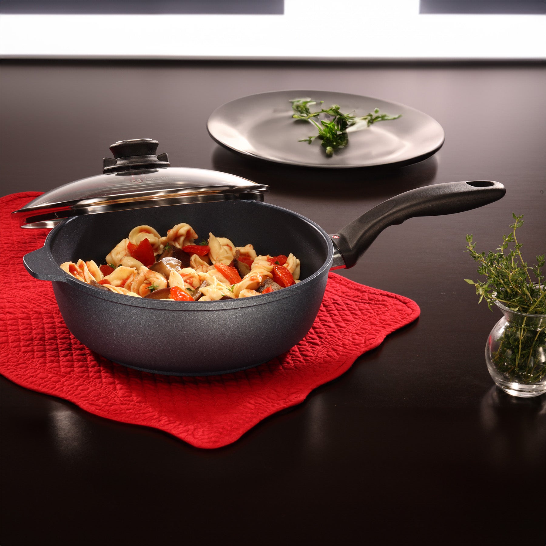 HD Nonstick Saute Pan with Glass Lid in use on dining room table