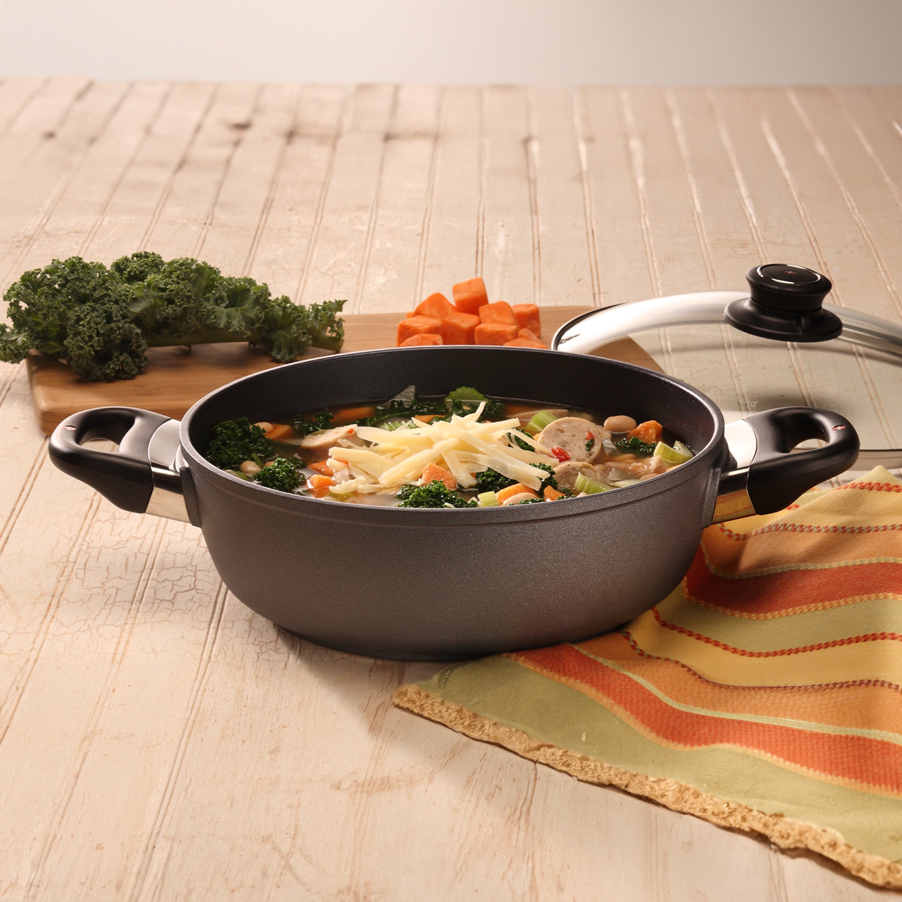 HD Nonstick Casserole with Glass Lid in use on wooden table