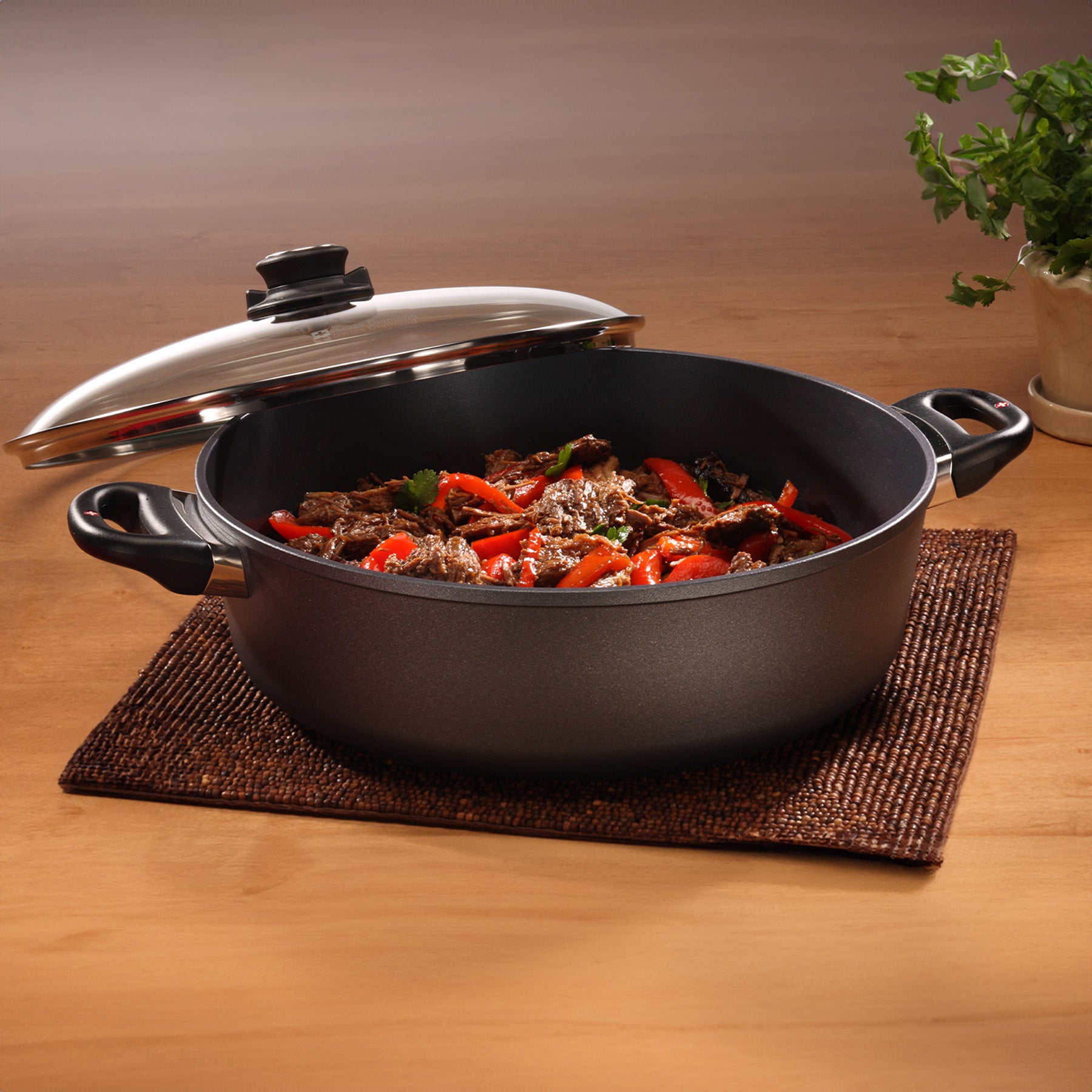 HD Nonstick Braiser with Glass Lid in use on dining room table