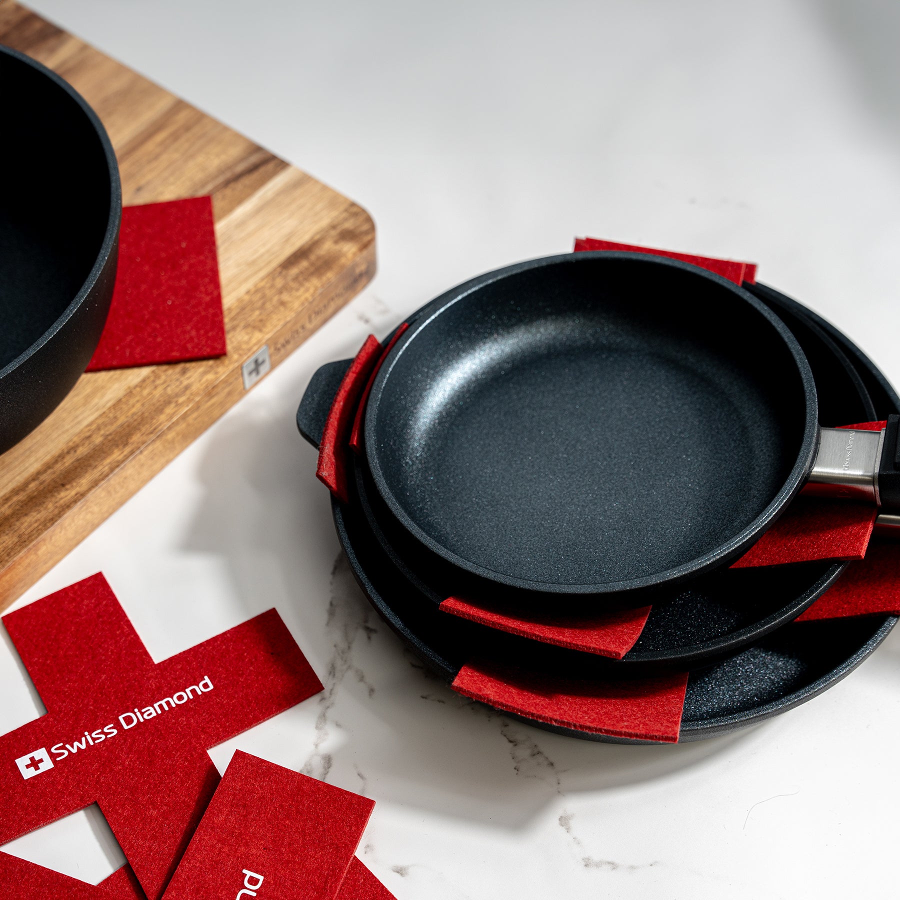 Felt Pan Protector placed in fry pans that are stacked on top of one another
