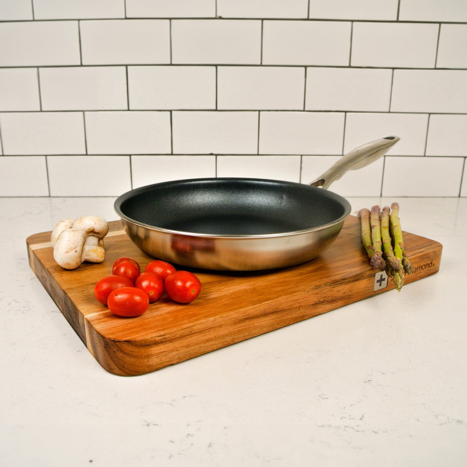 Nonstick Clad Fry Pan - Induction in use on cutting board