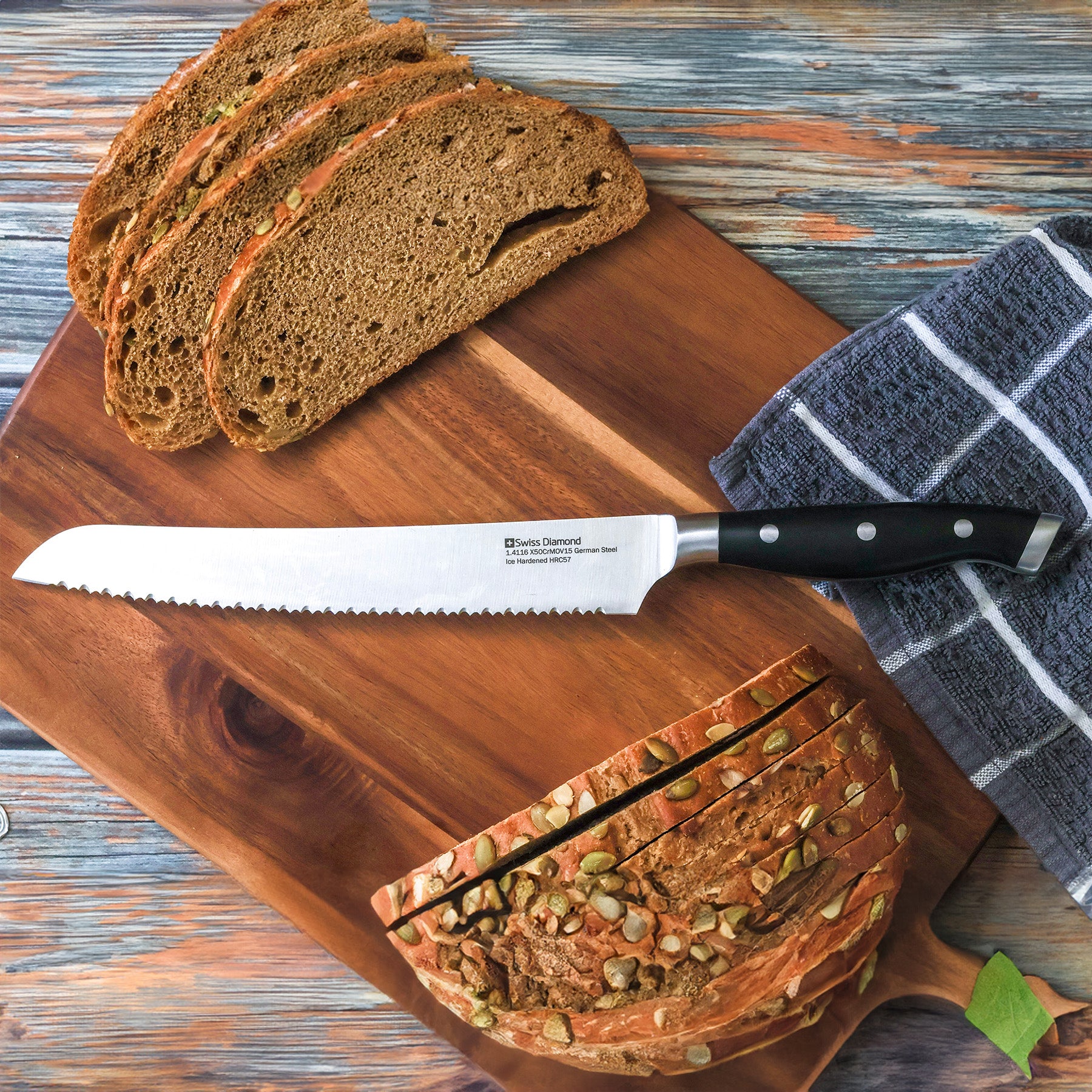 8.5" Bread Knife in use laying on cutting board next to sliced bread
