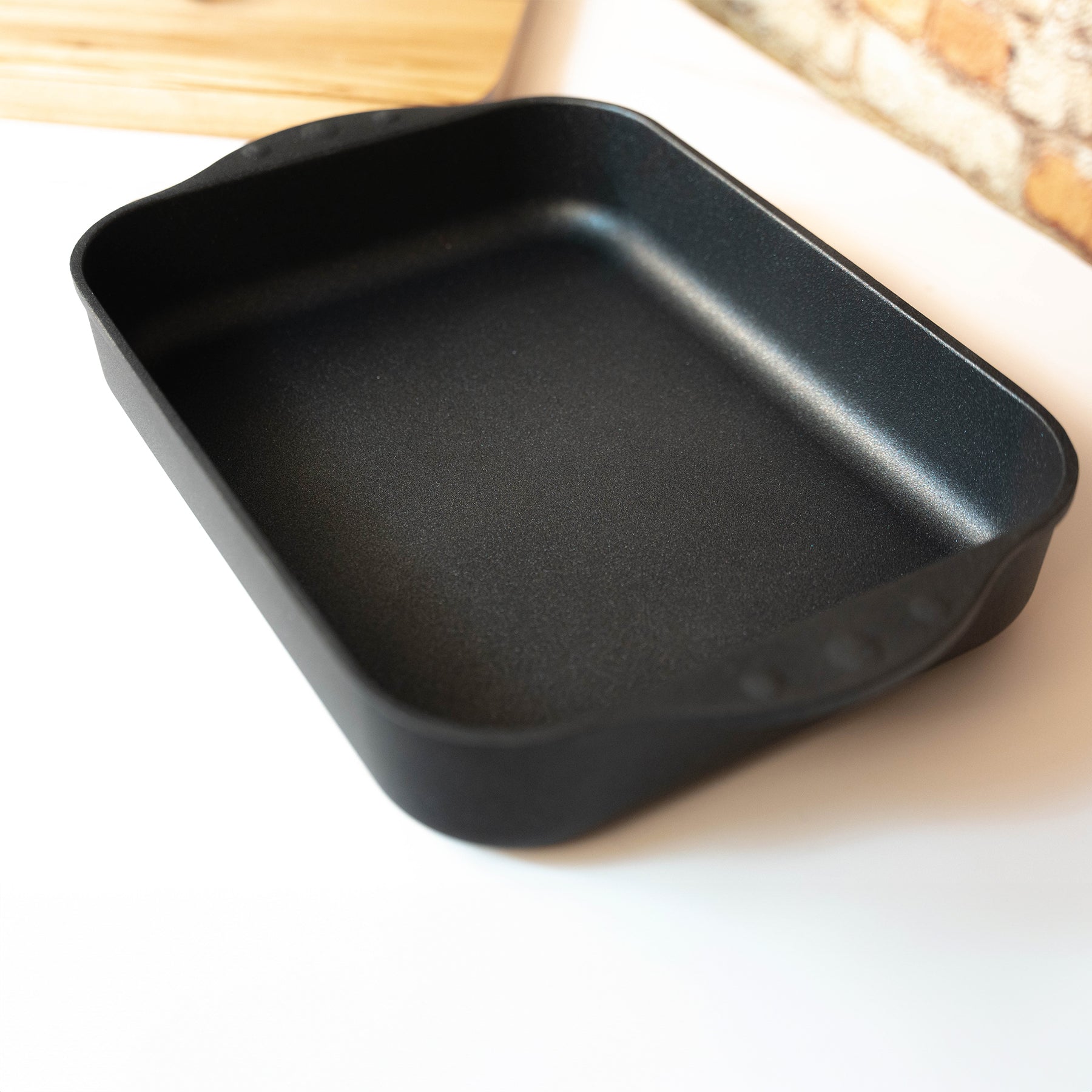 XD Nonstick Roasting Pan in use on kitchen counter