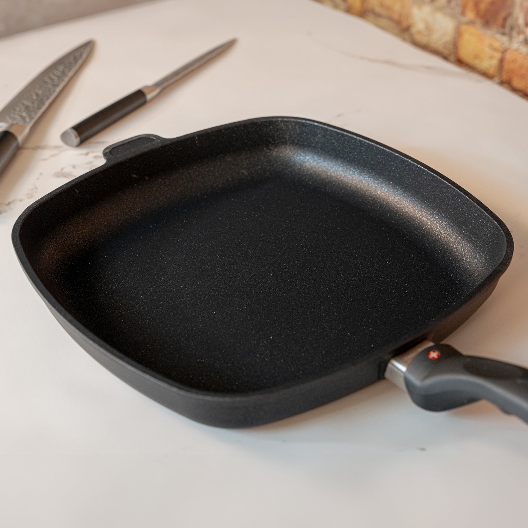 XD Nonstick 11" x 11" Square Fry Pan in used on marble kitchen counter