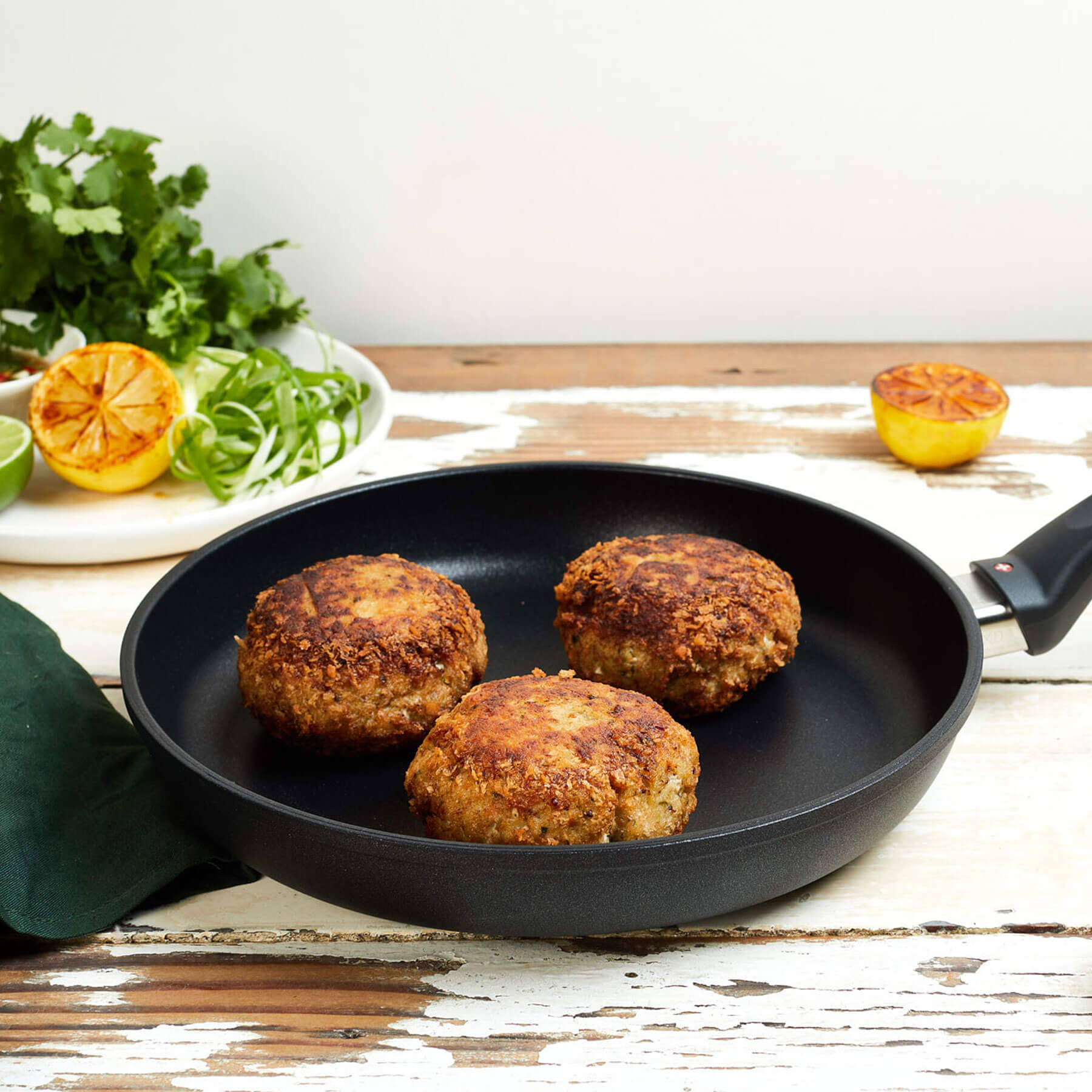 XD Nonstick Fry Pan - Induction in use on wooden table
