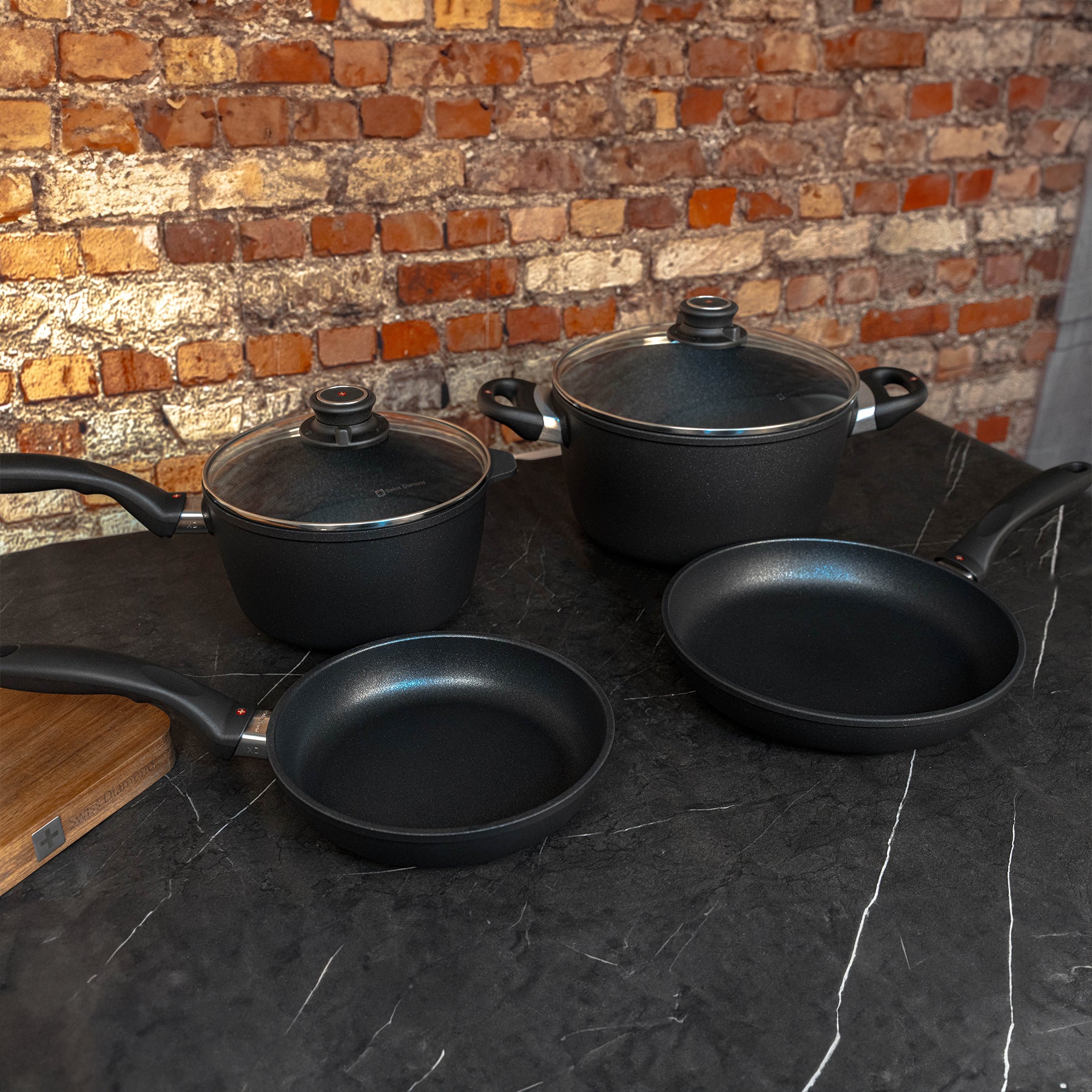 XD Nonstick 6-Piece Set - Fry Pan, Saucepan & Soup Pot - Induction side angled view on black marble counter top