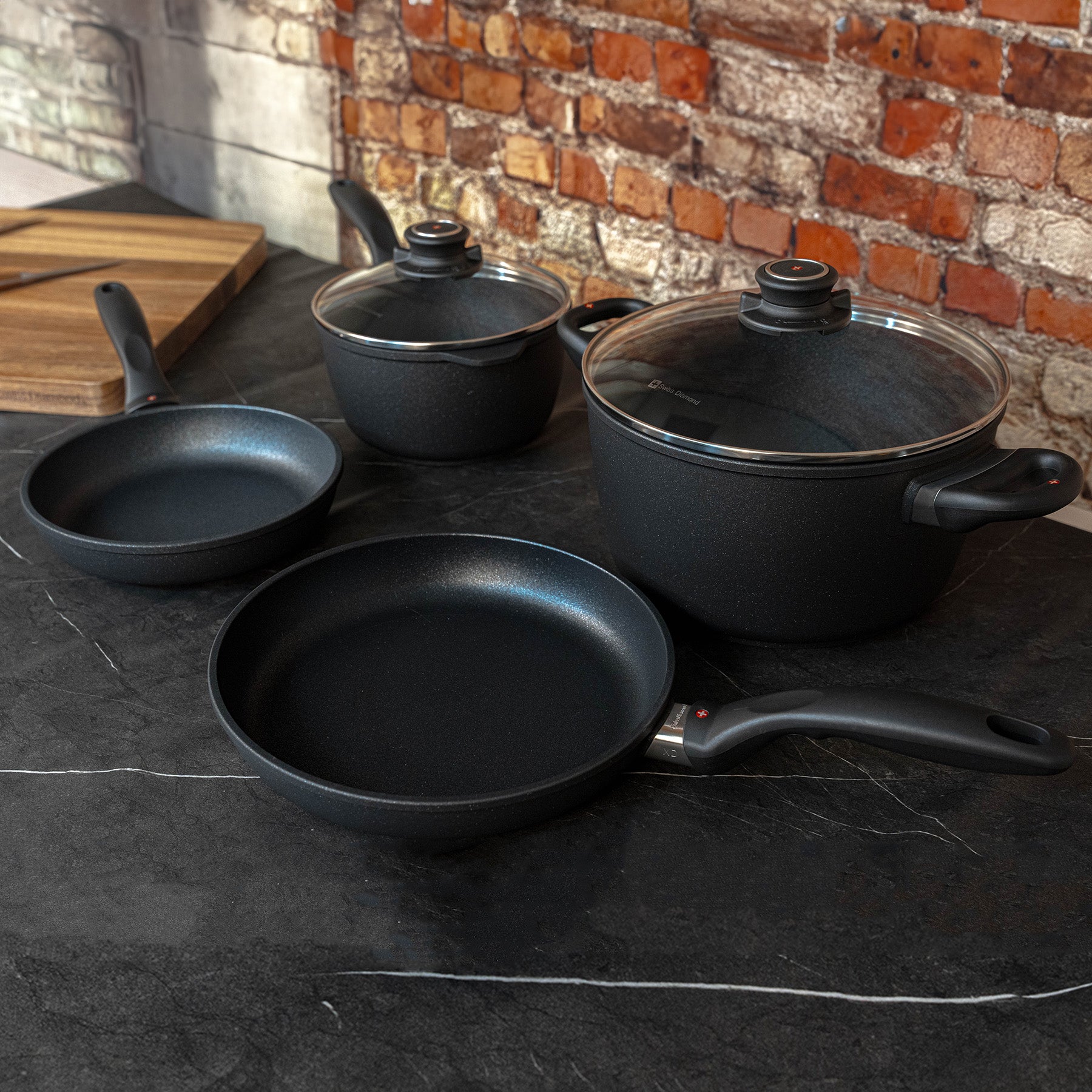 XD Nonstick 6-Piece Set - Newlywed Kitchen Kit angled side view on black marble countertop