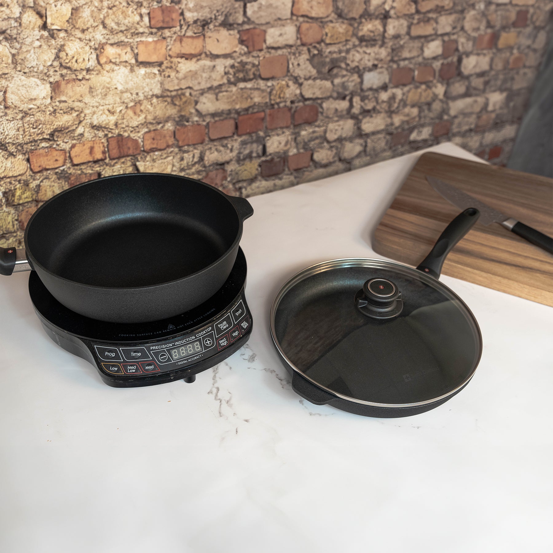 XD Nonstick 3-Piece Set - Fry Pan & Saute Pan - Induction on hot plate next to cutting board