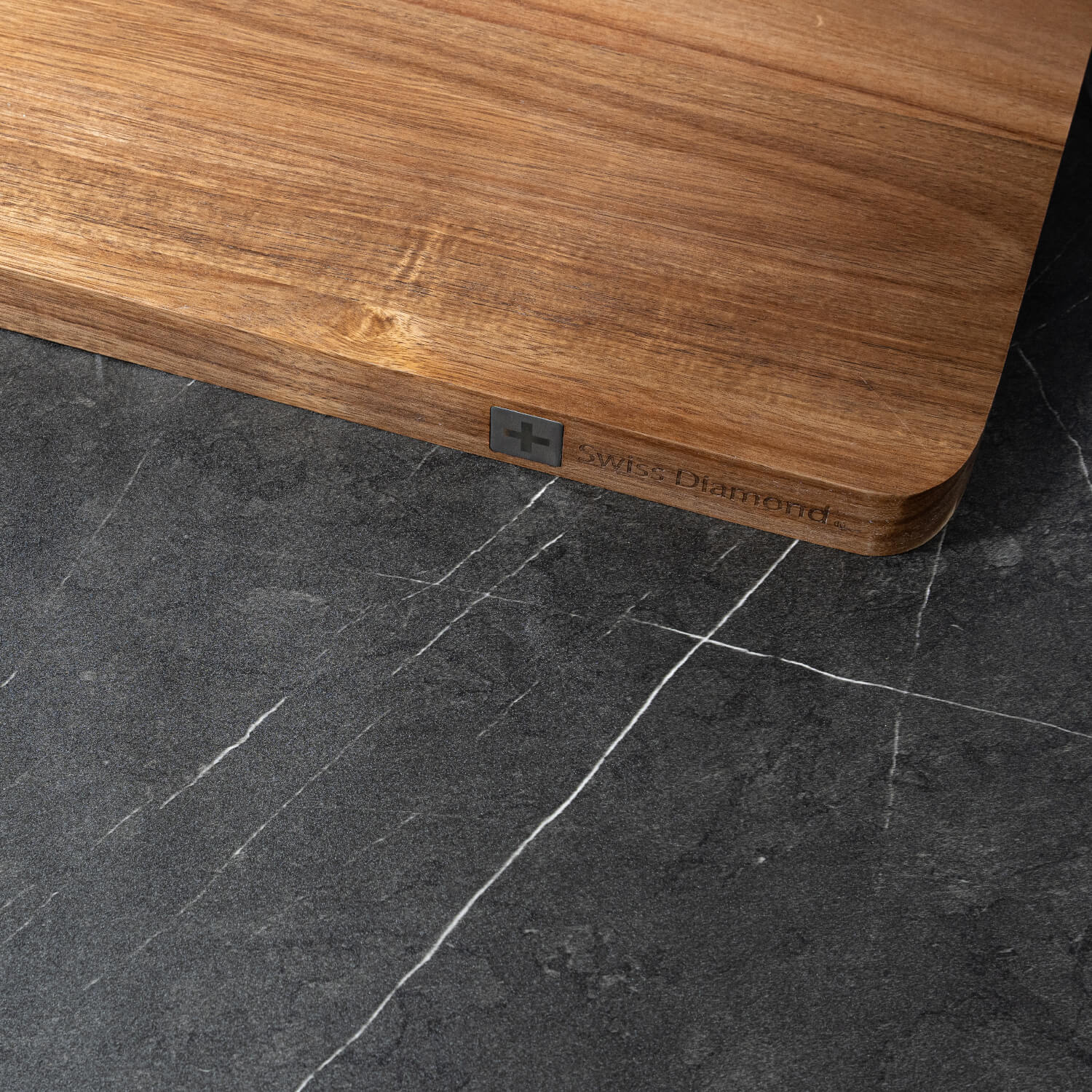 wooden cutting board at angle on kitchen counter with top view