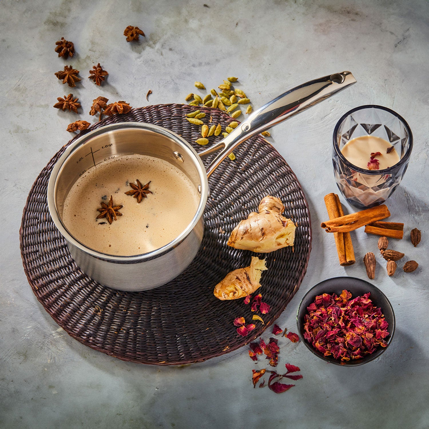 angled view of dlx saucepan sitting on a place mat with food inside