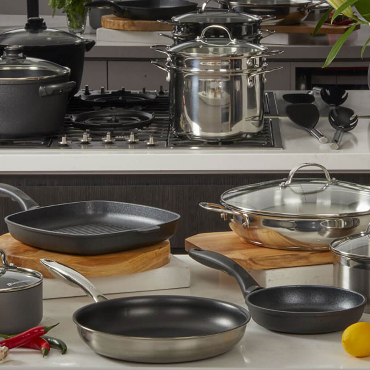 set of cookware on counter and stove top