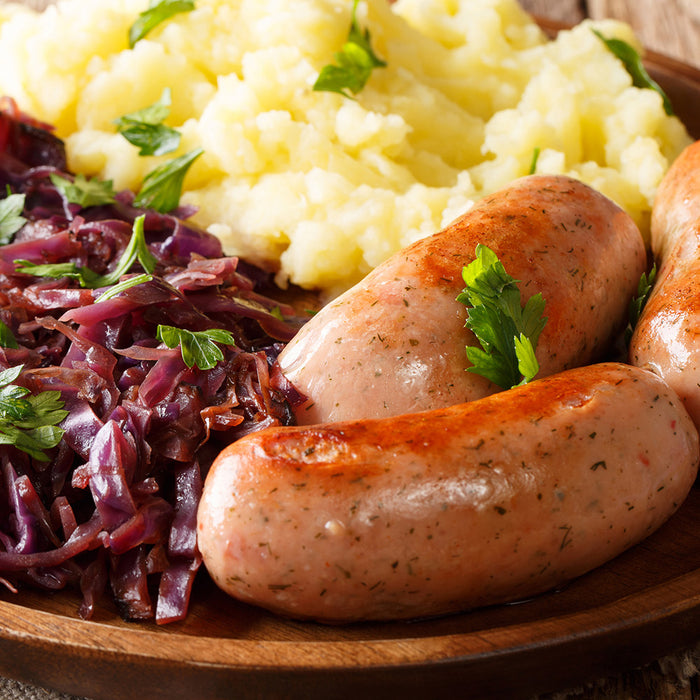 Bavarian red cabbage on a wood plate with sausage
