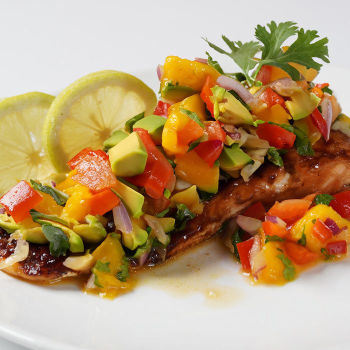 Piece of tilapia covered in salsa