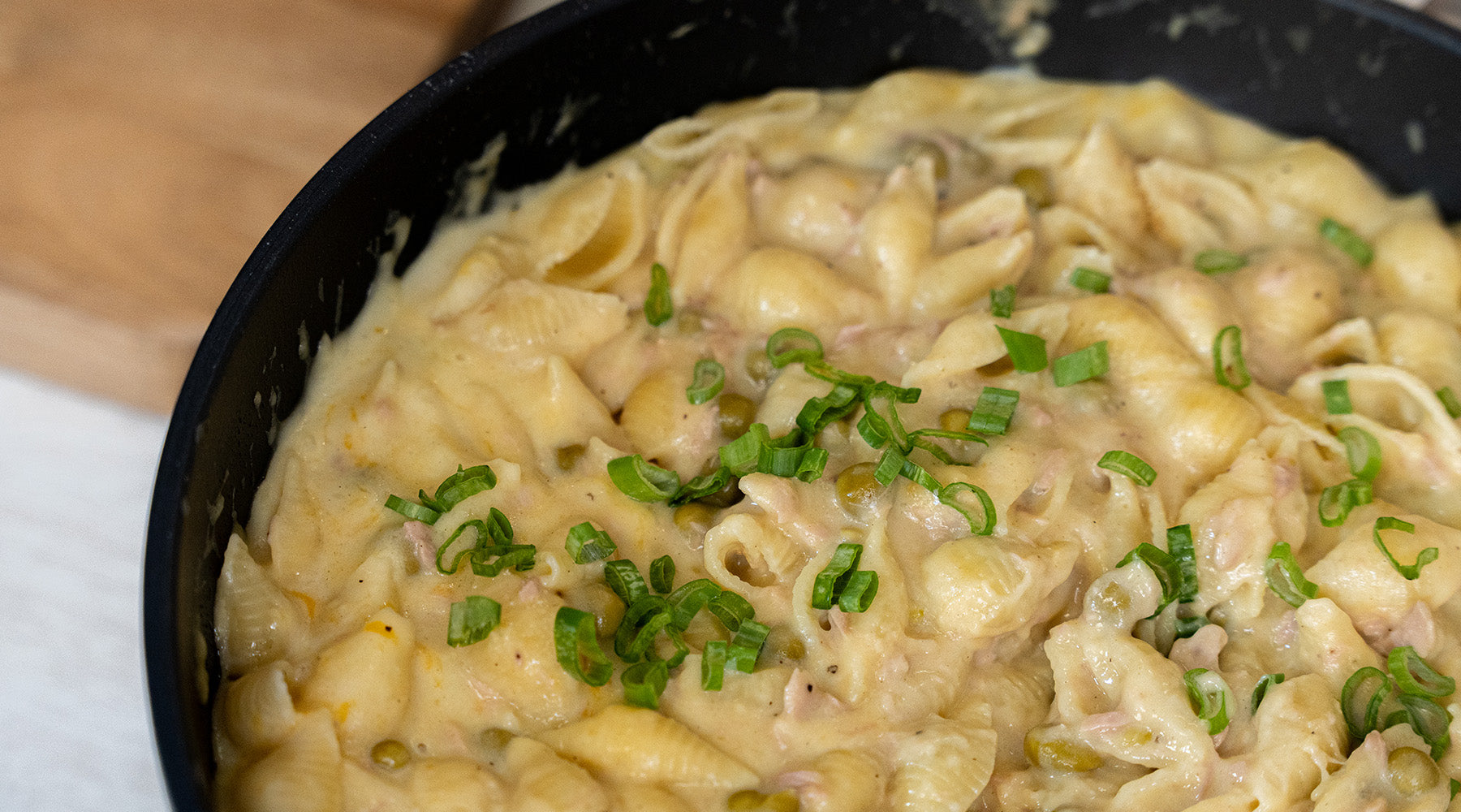 Tuna helper in a swiss diamond pot topped with green onion