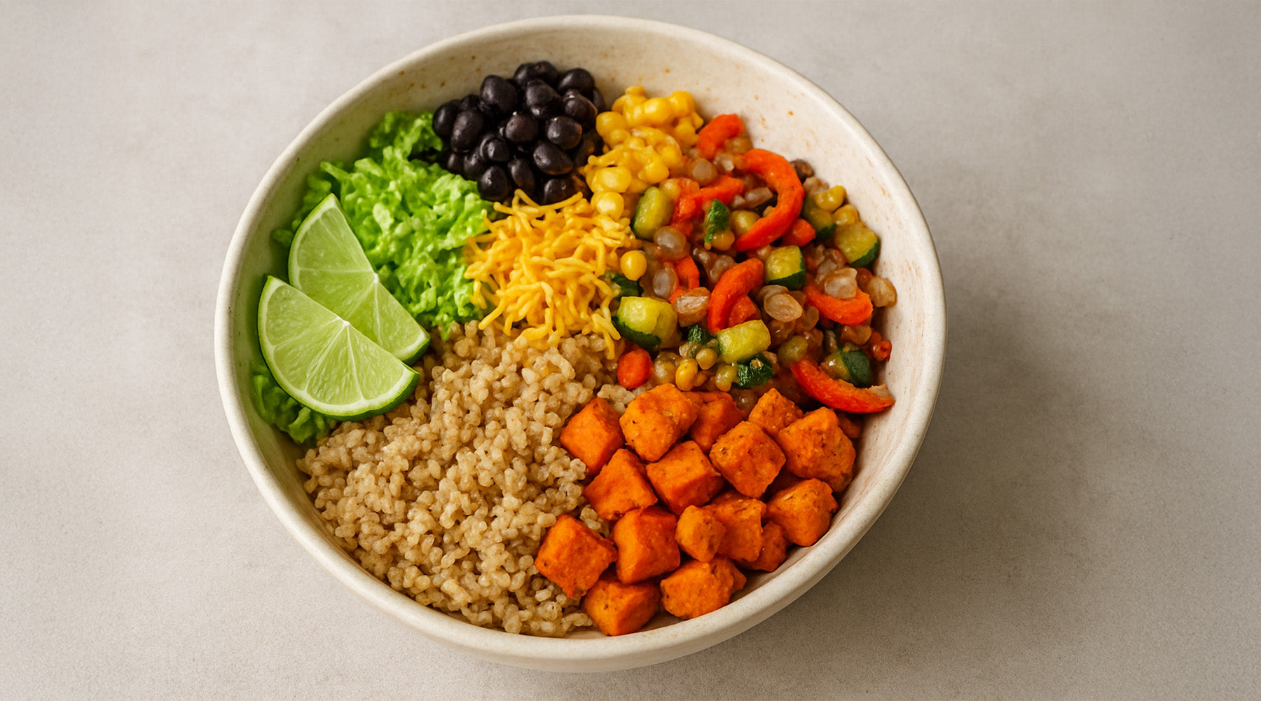 Taco bowl served in a white bowl on a white countertop