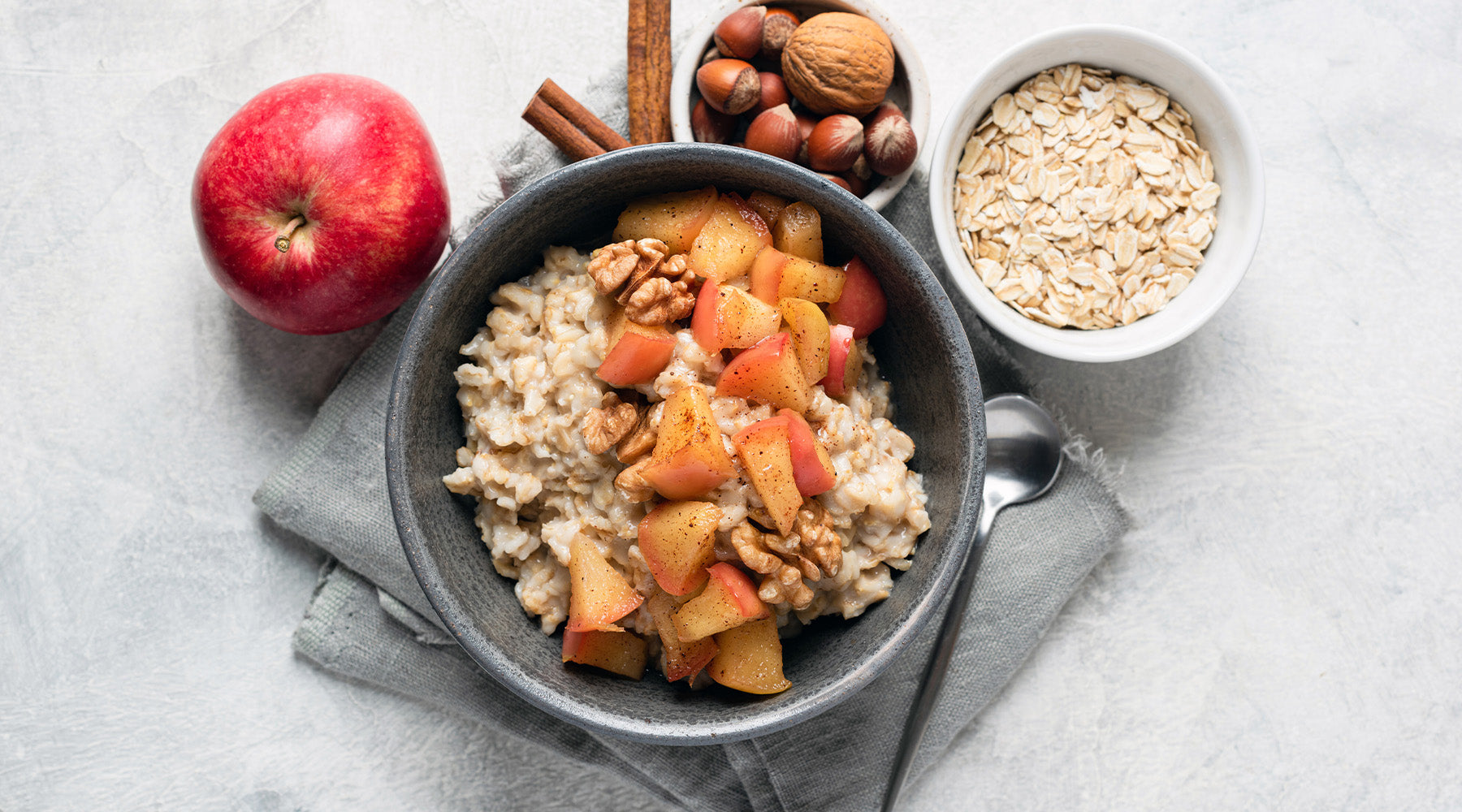 Overnight Apple Pie Steel Cut Oatmeal on Counter surrounded by toppings