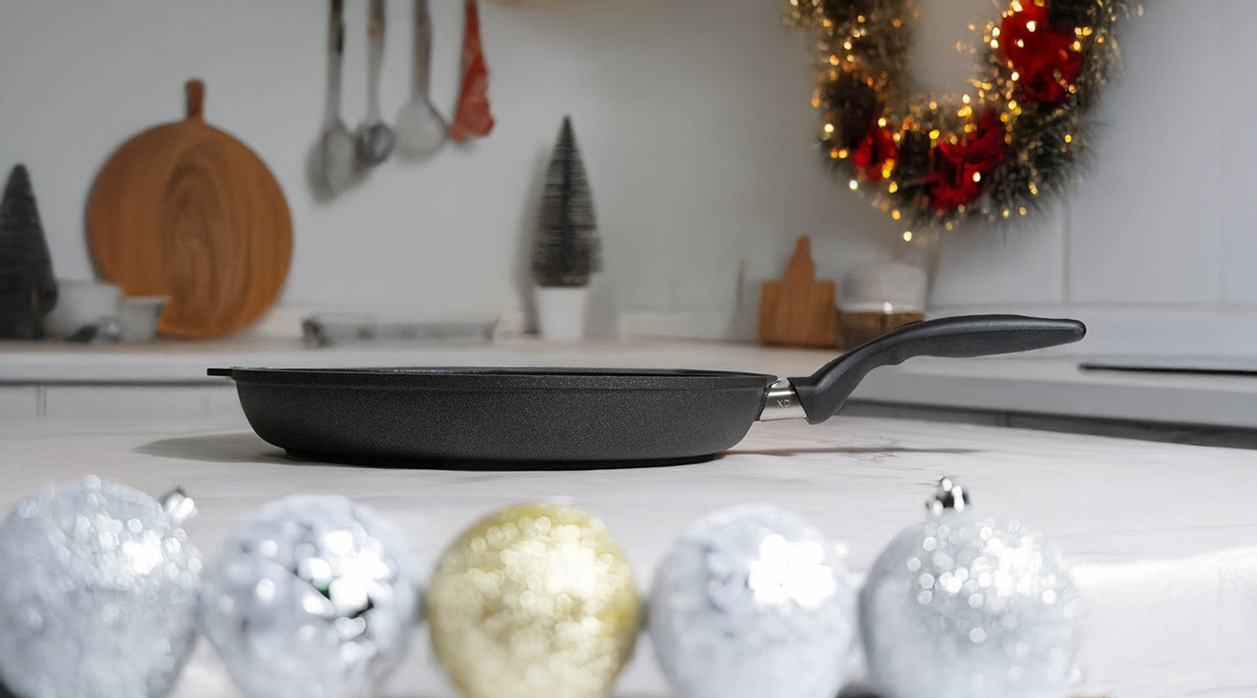 Early Black Friday Deals with fry pan on kitchen counter and holiday decorations