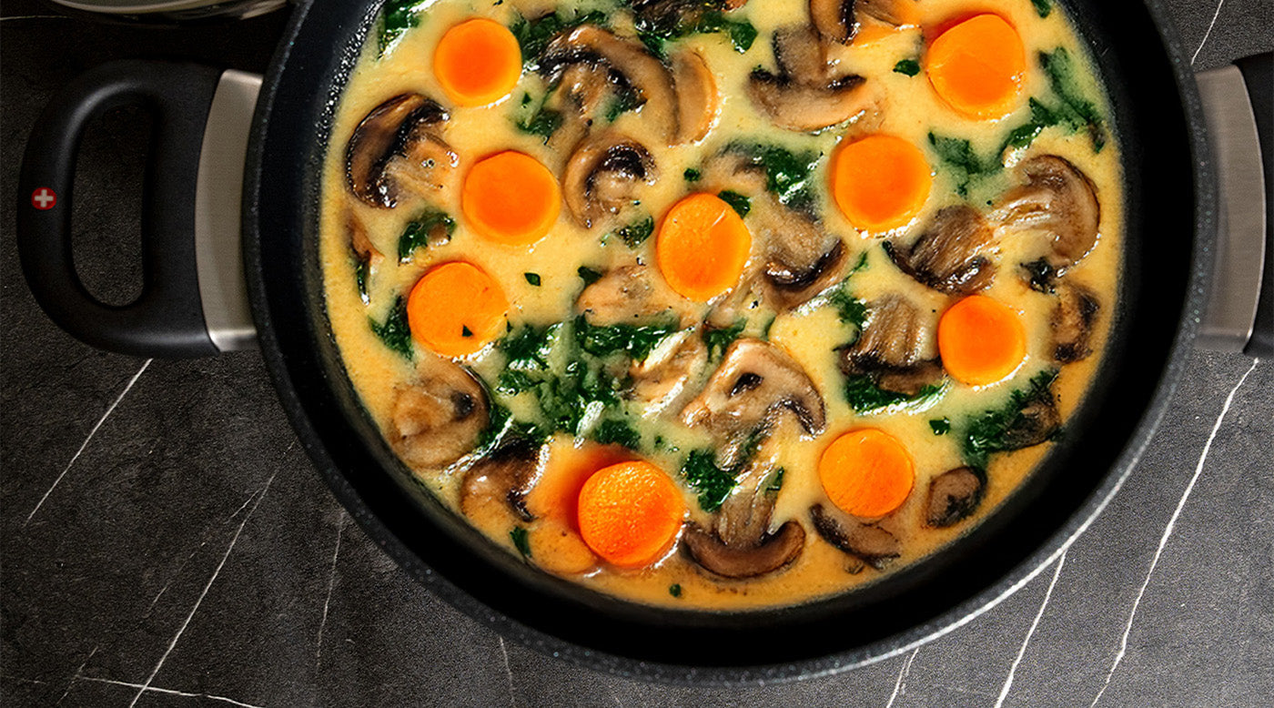 Nonstick soup & stock pots with food on kitchen counter