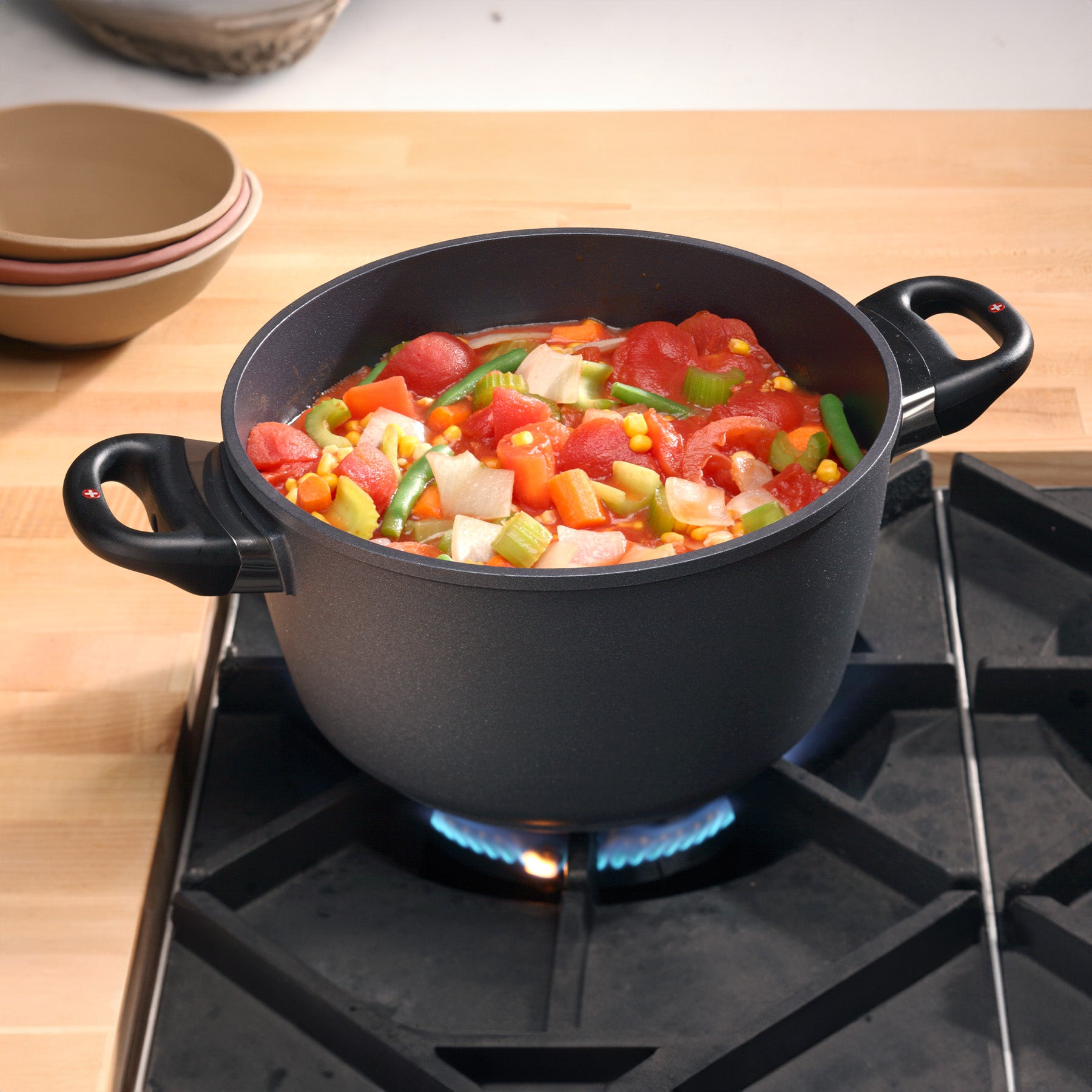 HD Nonstick Stock Pot with Glass Lid in use on kitchen gas stove top