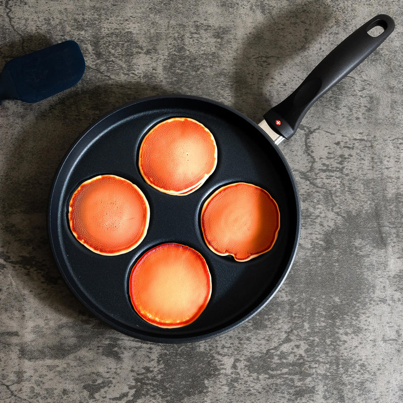 HD Nonstick 10.25" Plett Pan - Induction top view in use with pancakes in pan and on marble kitchen counter