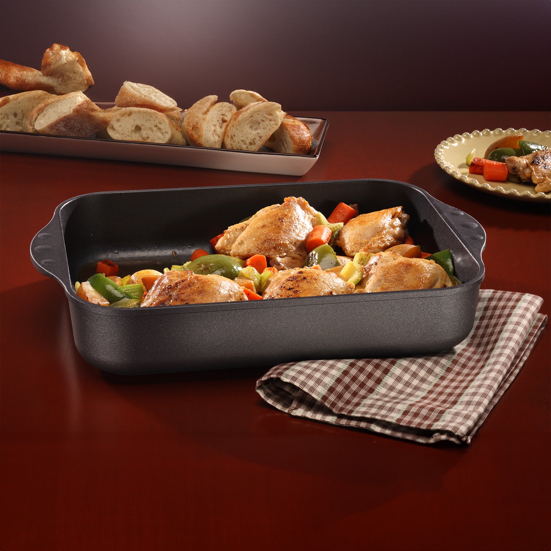 HD Nonstick Roasting Pan in use on wooden table