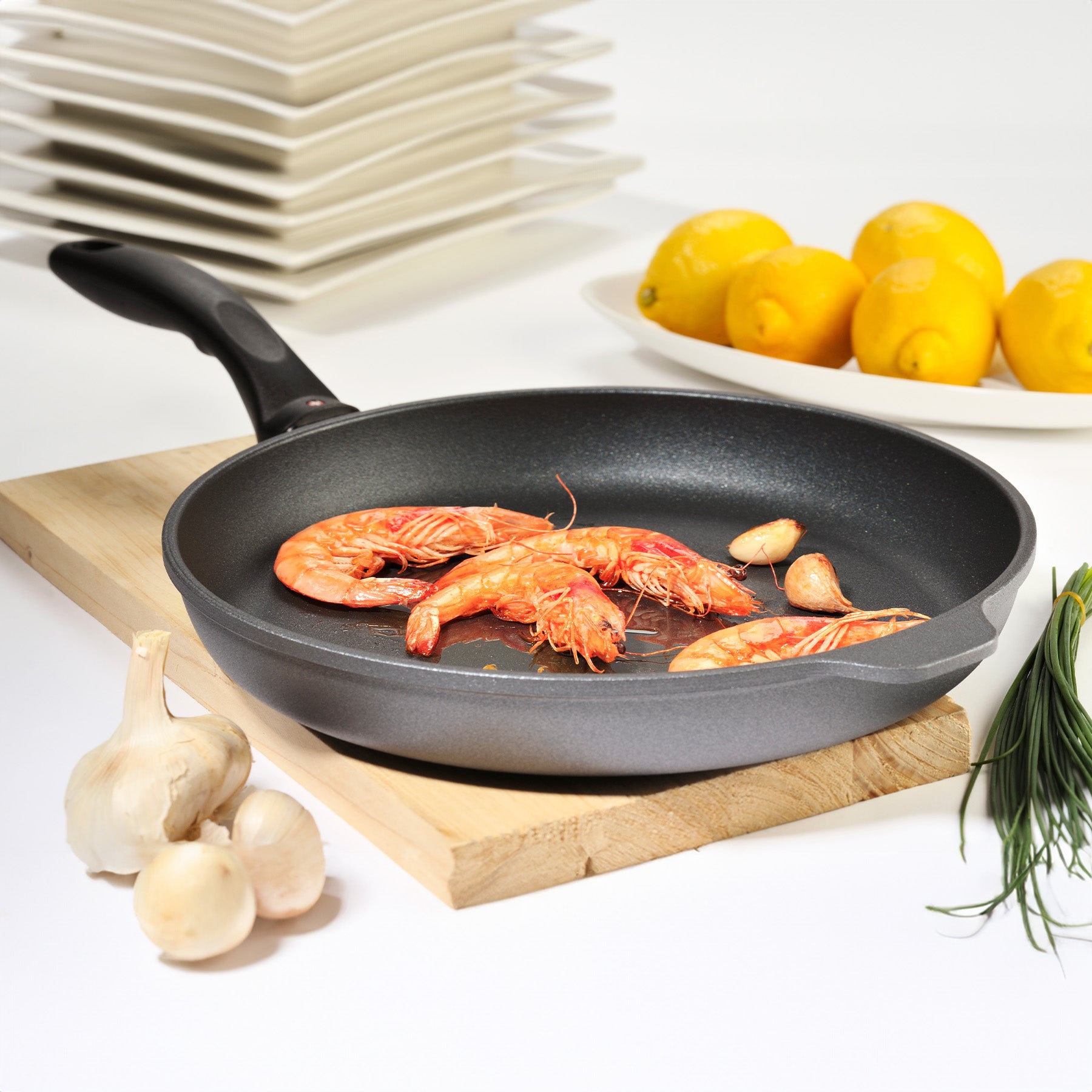 HD Nonstick Fry Pan - Induction in use on cutting board