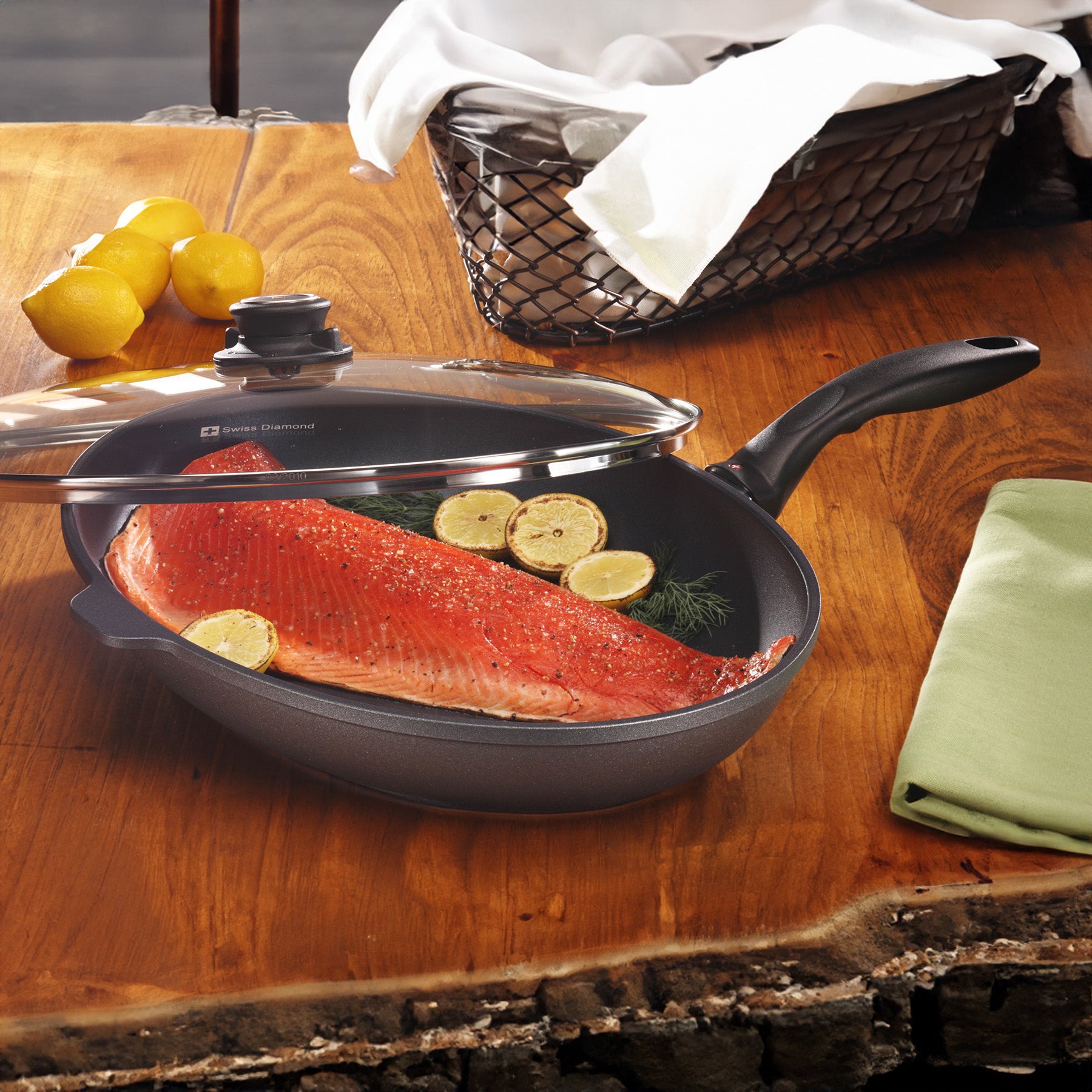 HD Nonstick Oval Fish Pan with Glass Lid in use on wooden table