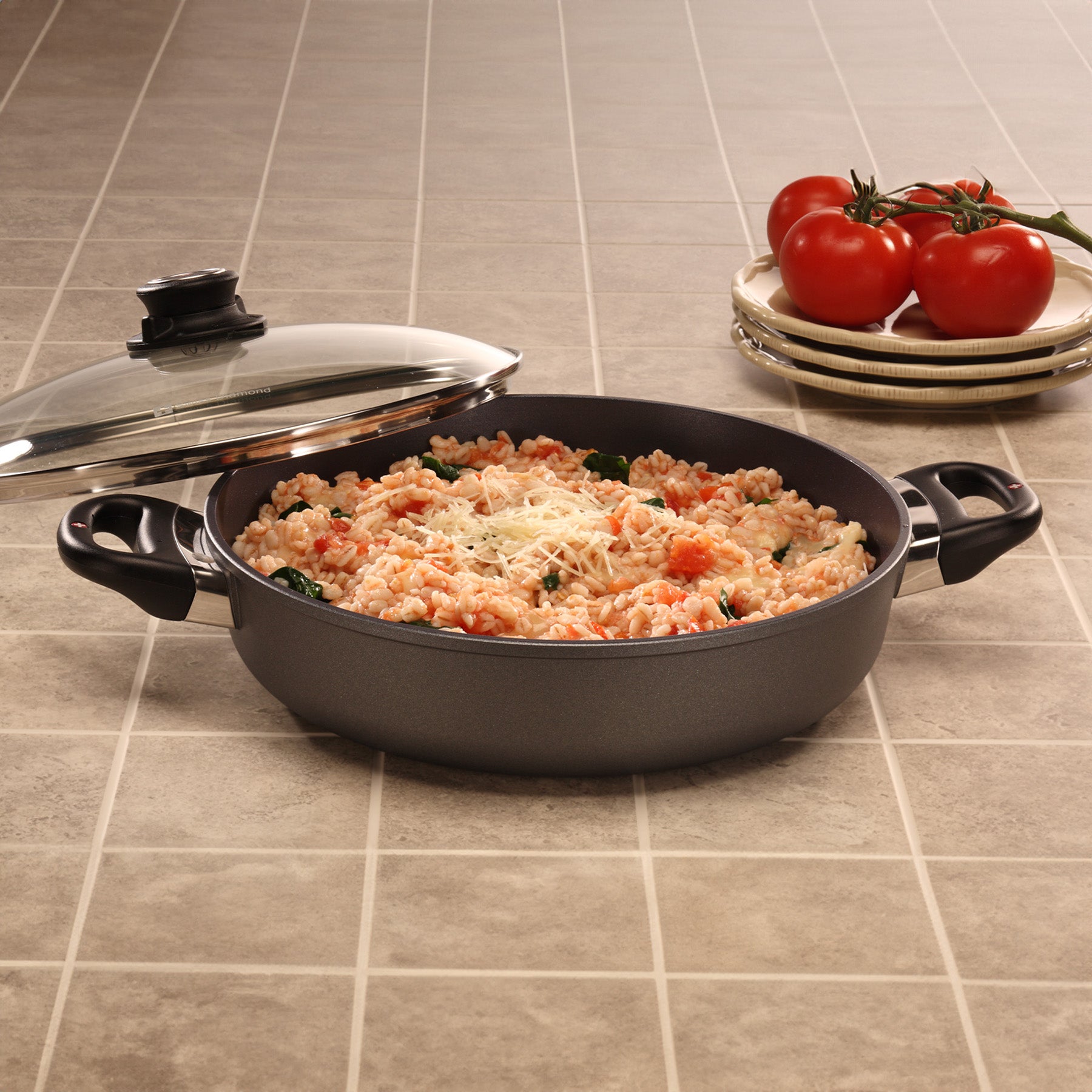 HD Nonstick Sauteuse with Glass Lid in use on kitchen counter
