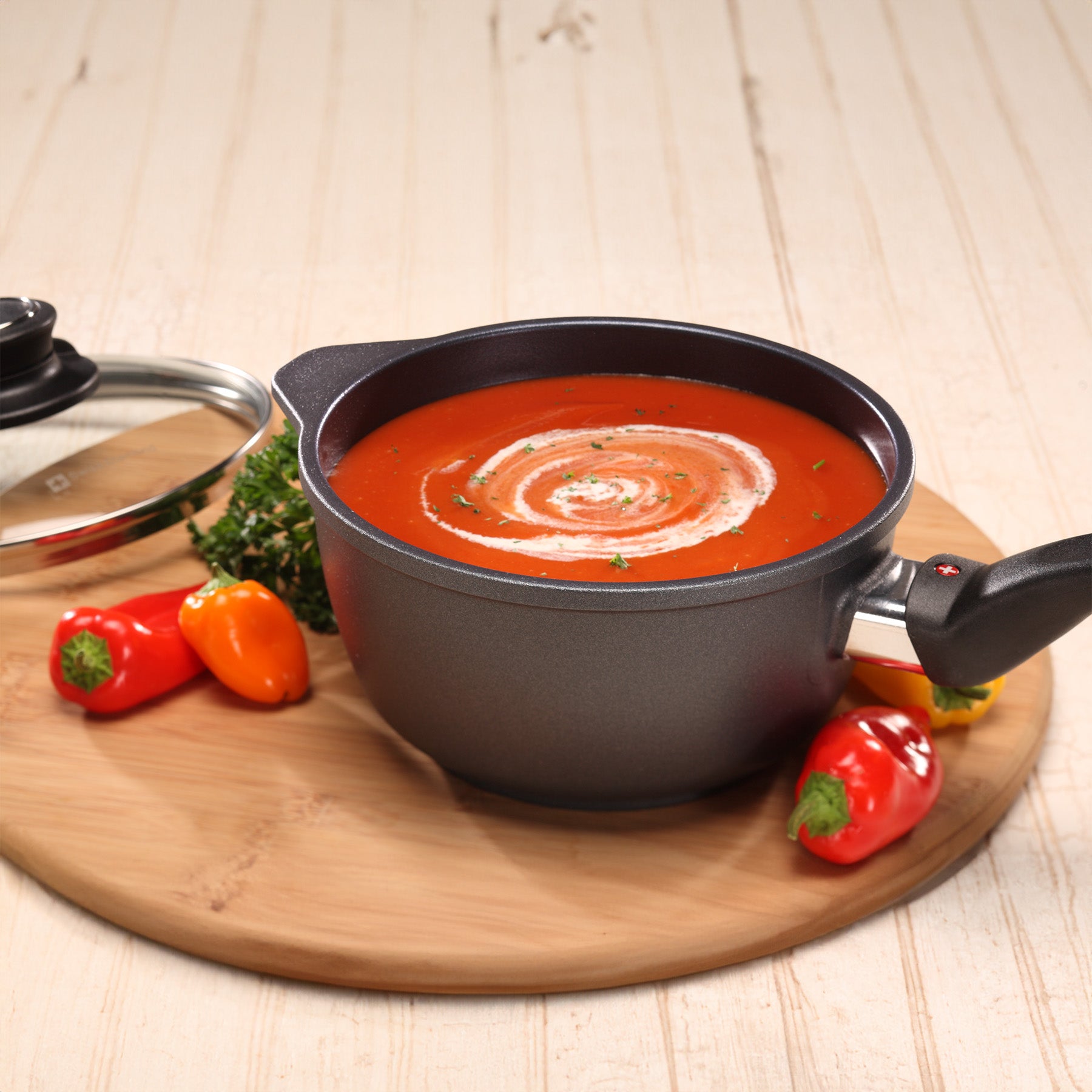 HD Nonstick Saucepan with Glass Lid in use on wooden table