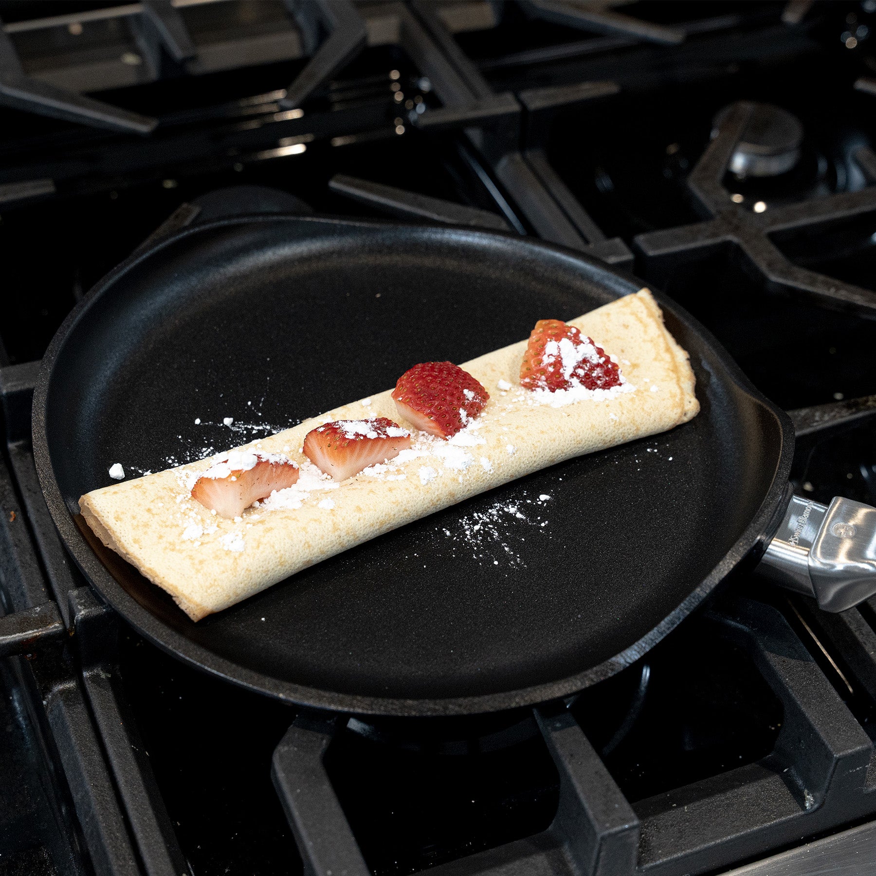 CHD Nonstick 10.25" Crepe Pan on gas stove with food inside