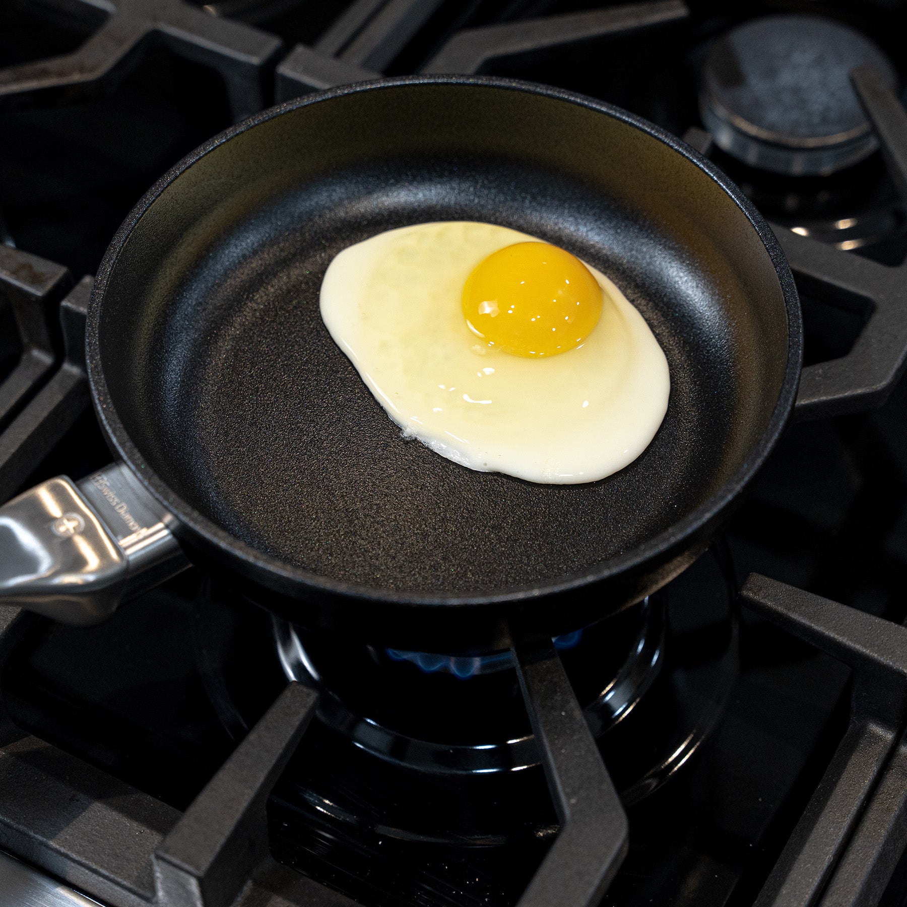 CHD Nonstick 7 Fry Pan on gas stove top with food inside