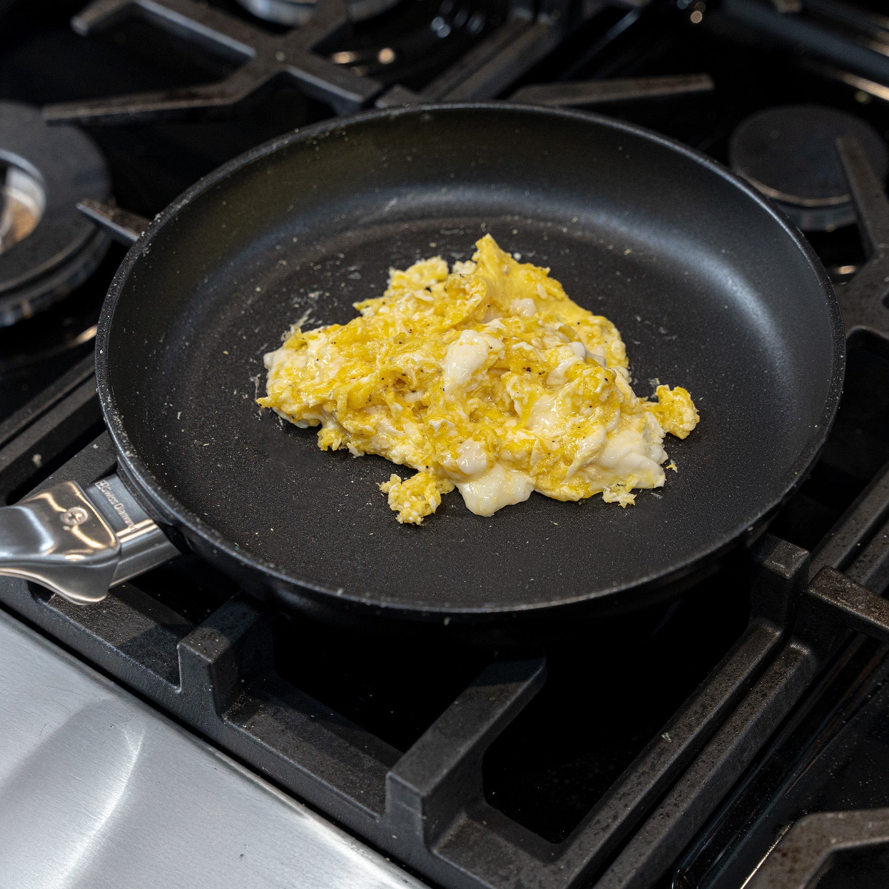 CHD Nonstick 9.5" Fry Pan on gas stove top with food inside