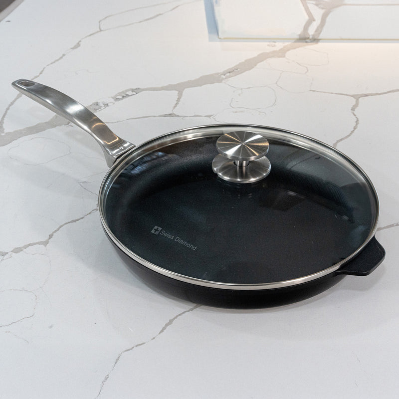 CHD Nonstick 11" Fry Pan with glass lid on white marble kitchen counter