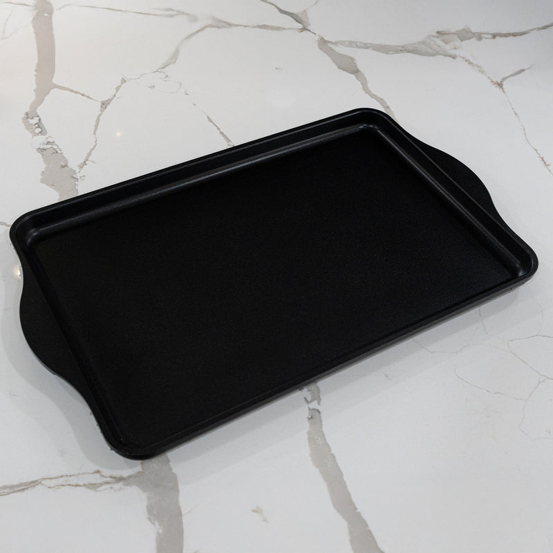 CHD Nonstick 17" x 11" Double-Burner Griddle on white marble kitchen counter