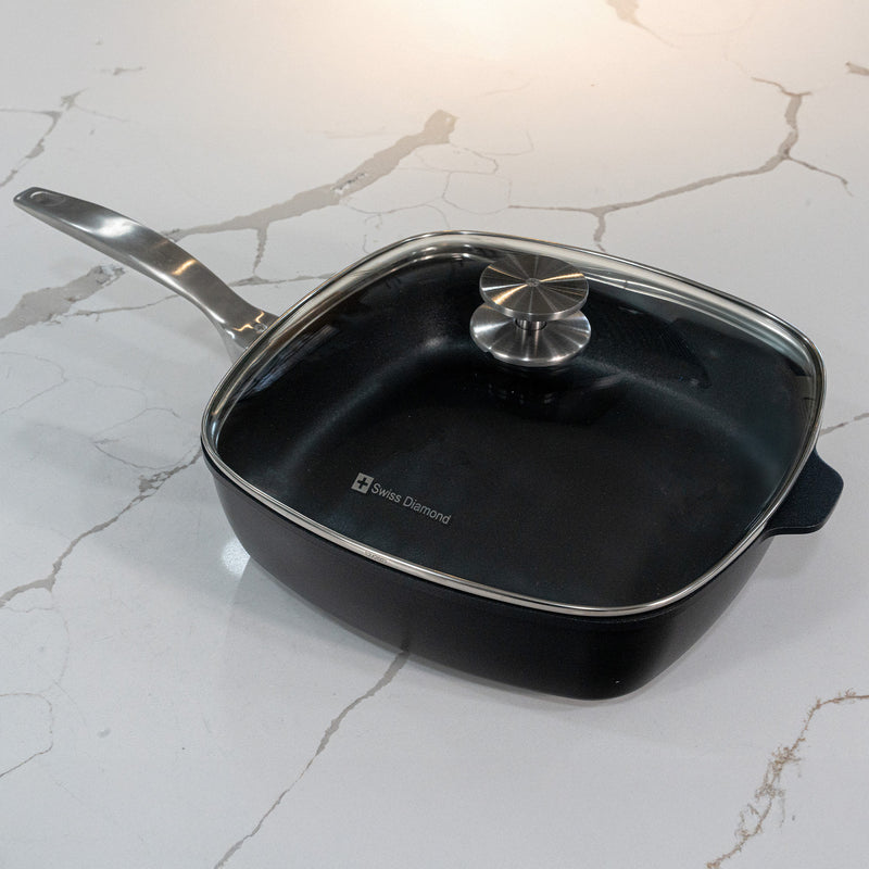 CHD Nonstick 11" x 11" Square Saute Pan with Glass Lid on white marble kitchen counter