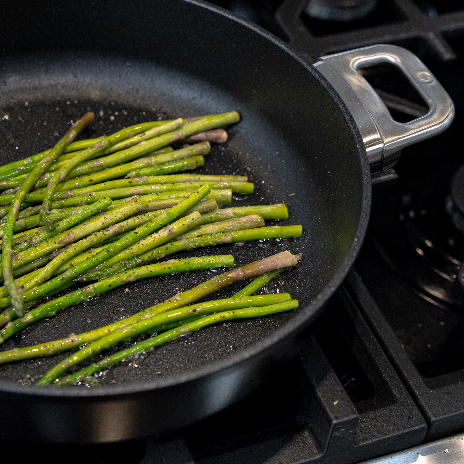 CHD Nonstick 3.7 qt Sauteuse with Glass Lid on gas stove with food inside