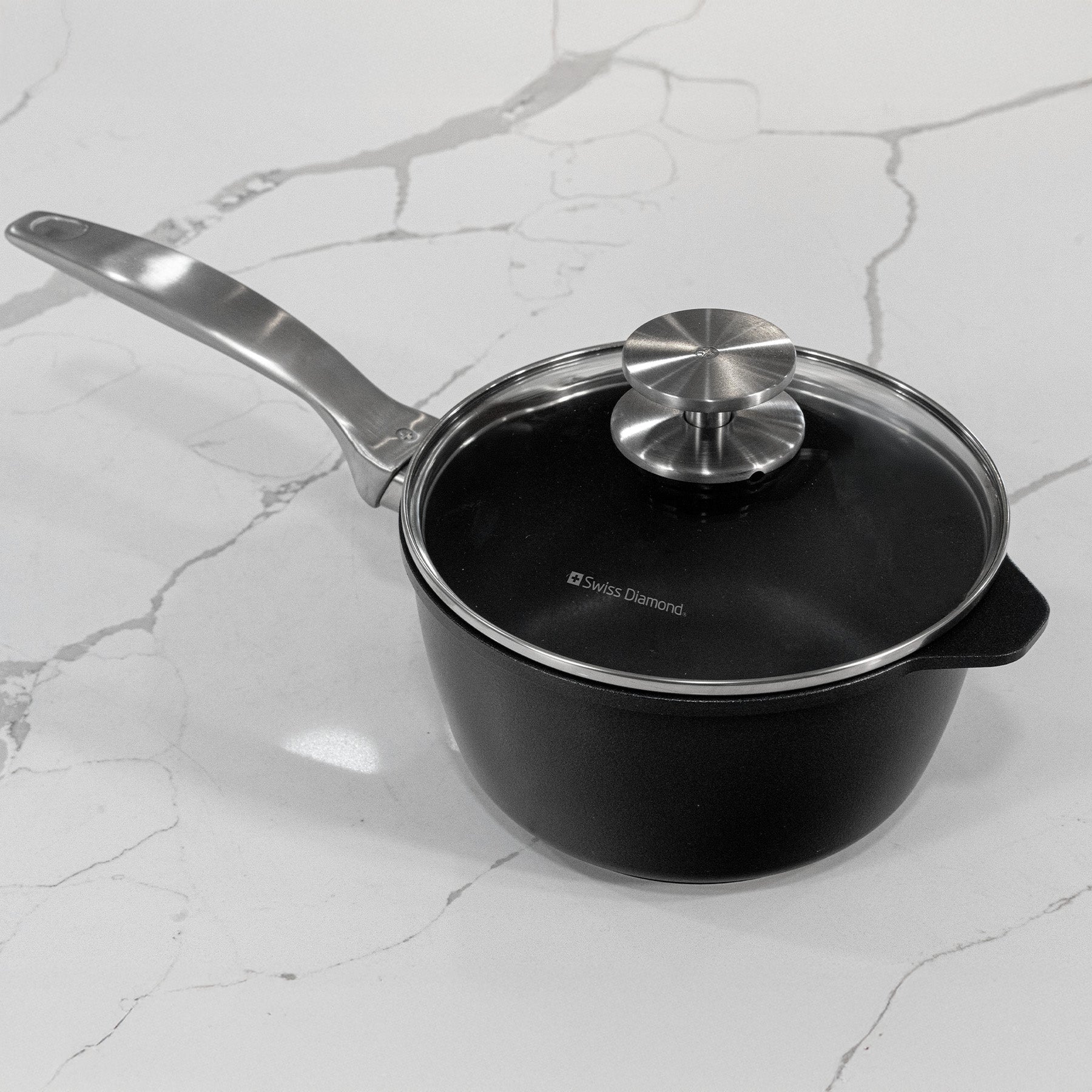 CHD Nonstick 2.2 qt Saucepan with Glass Lid on gray marble kitchen counter