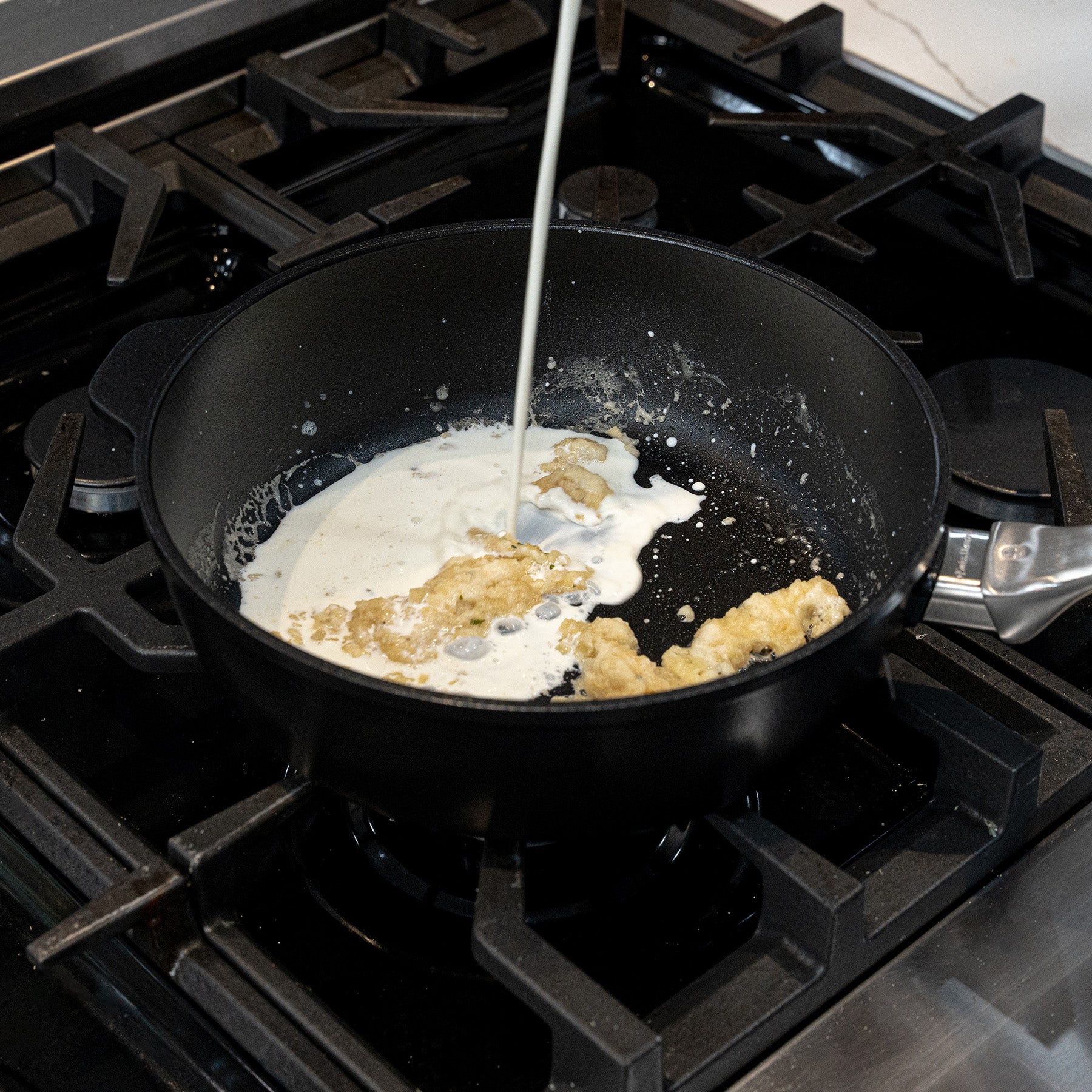 CHD Nonstick 3.2 qt Saute Pan with food inside on gas stove