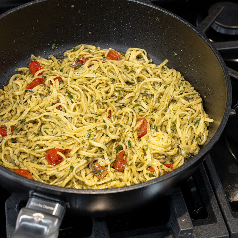 CHD Nonstick 4.3 qt Saute Pan with food inside on gas stove