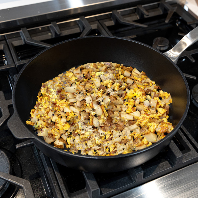 CHD Nonstick 5.8 qt Saute Pan on gas stove with food inside