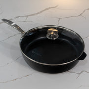 CHD Nonstick 5.8 qt Saute Pan with glass lid on white kitchen marble counter